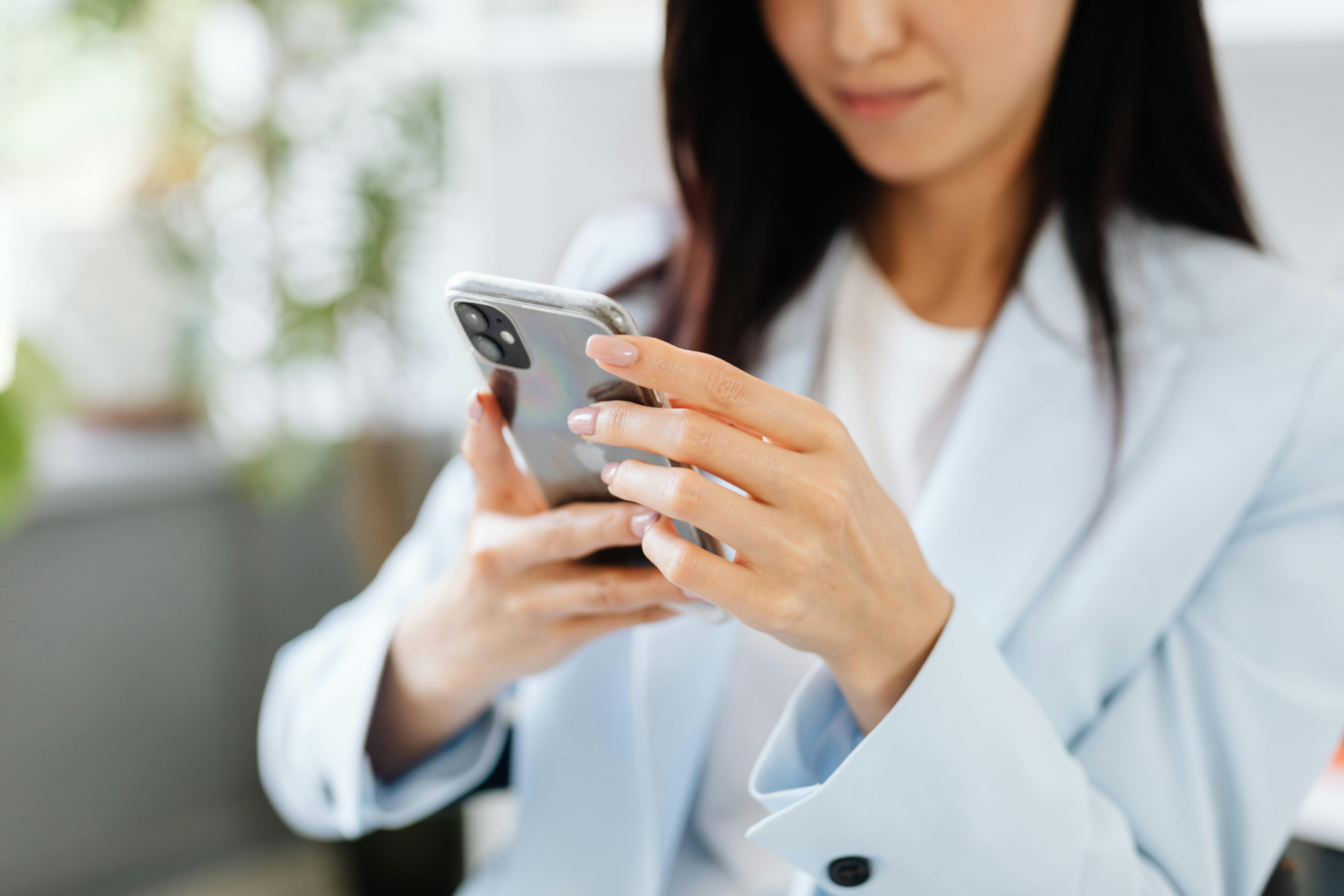 Woman checking her phone | Source: Pexels