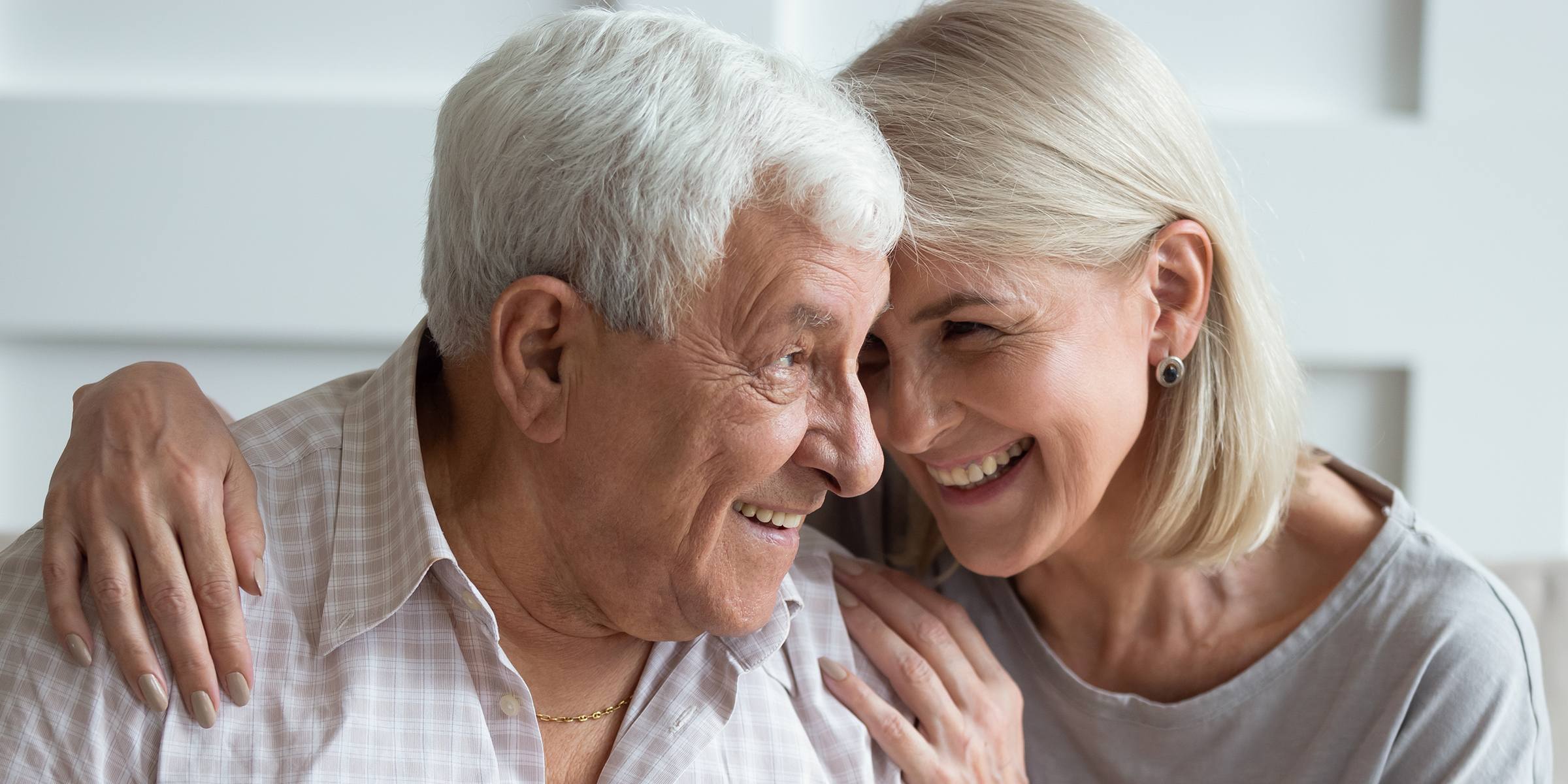 An older couple laughing | Source: Shutterstock