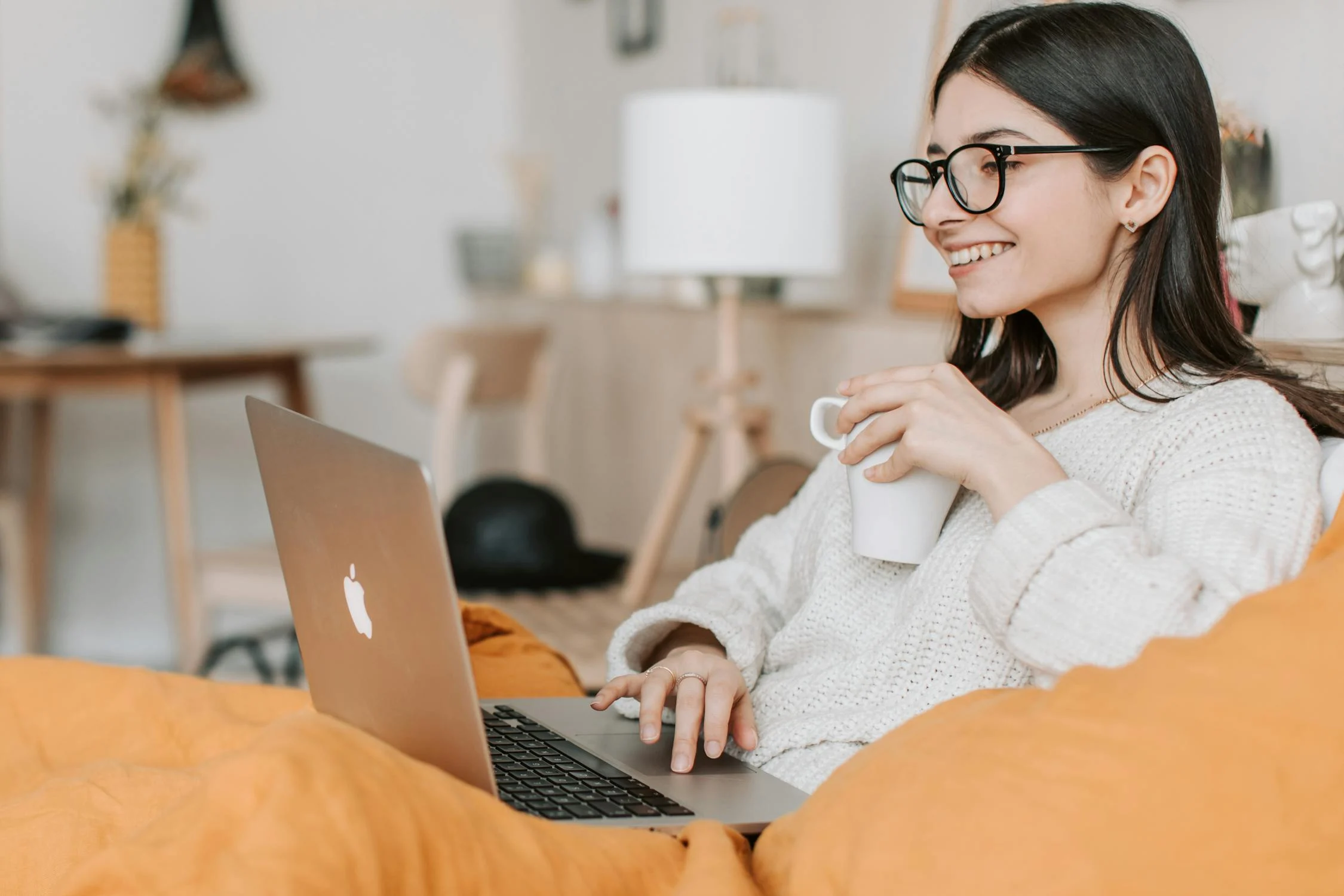 A satisfied woman with a laptop | Source: Pexels