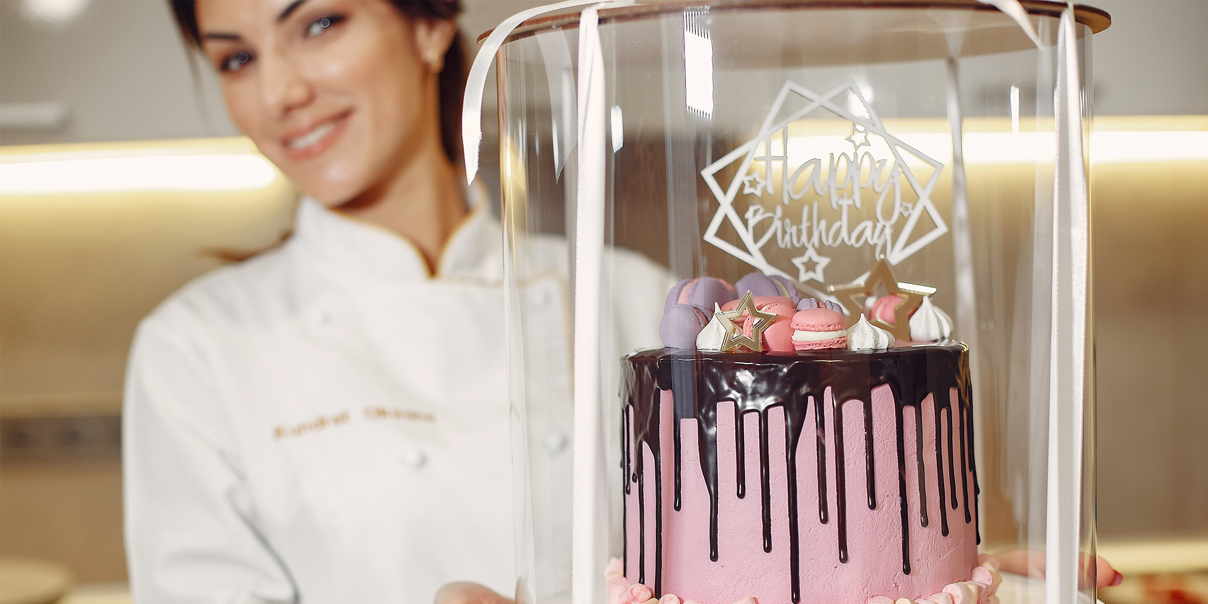 A happy woman holding a birthday cake | Source: Shutterstock
