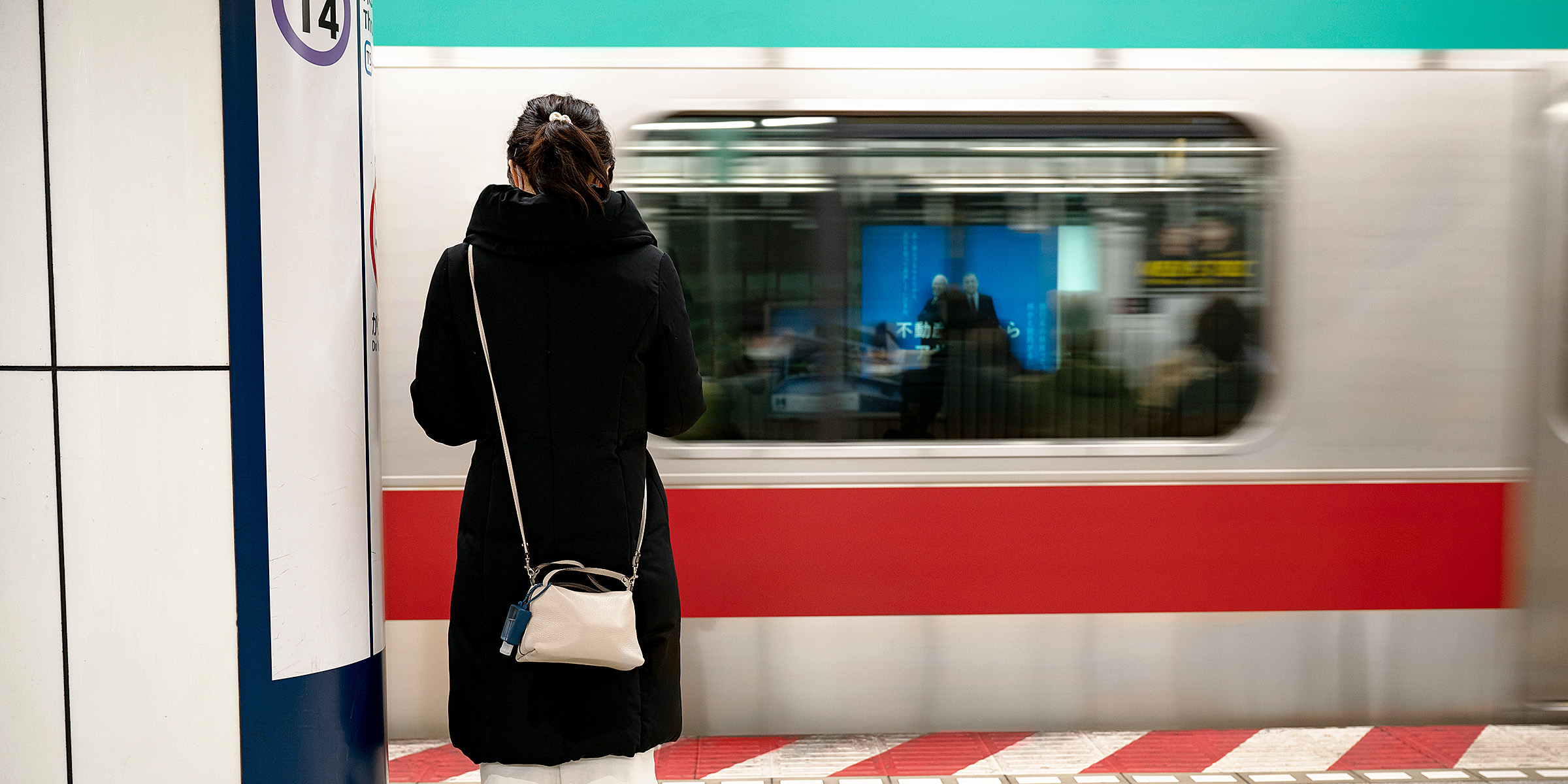 A woman standing in a subway station | Source: Freepik