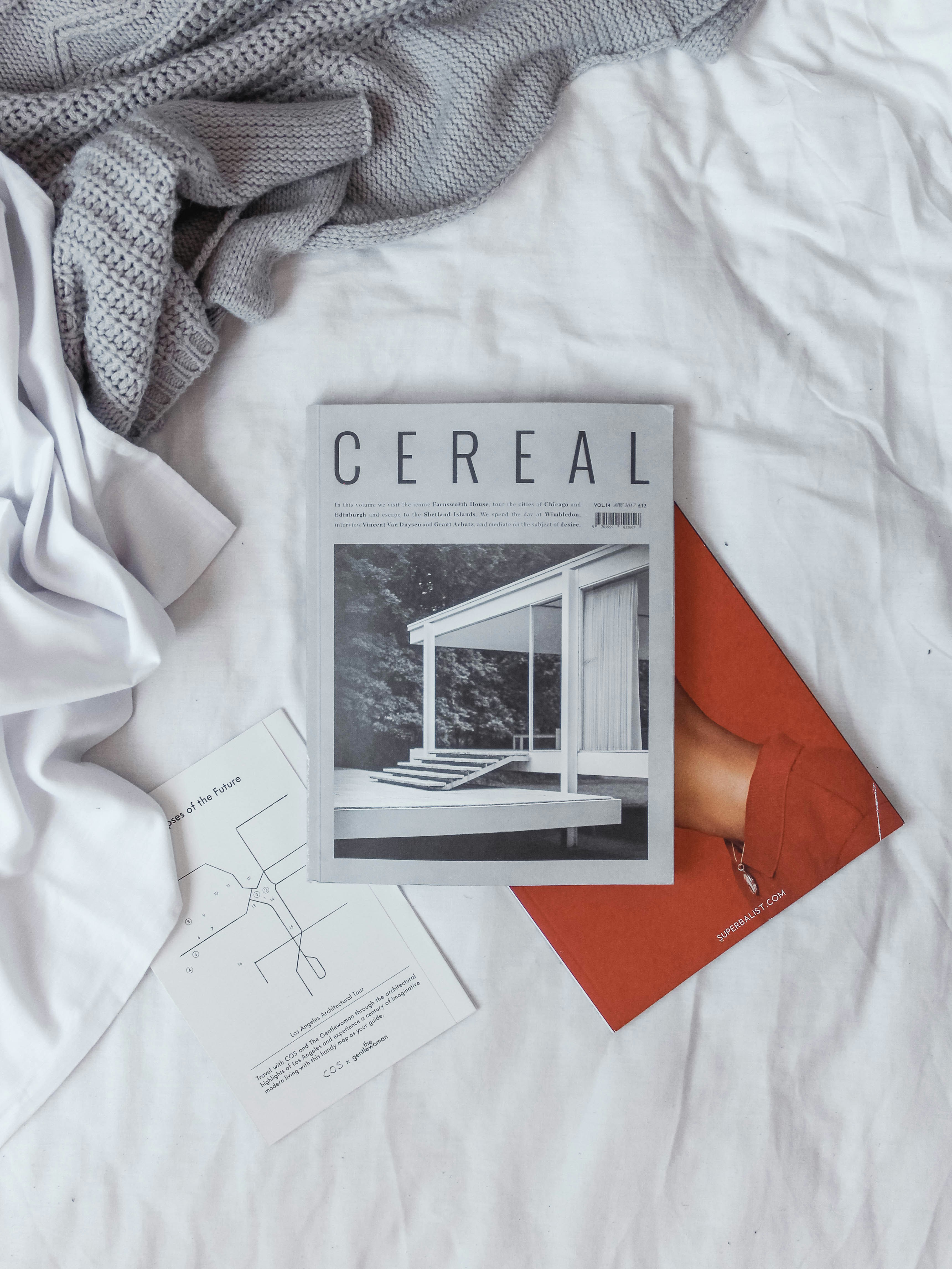 Magazines on a bed | Source: Unsplash