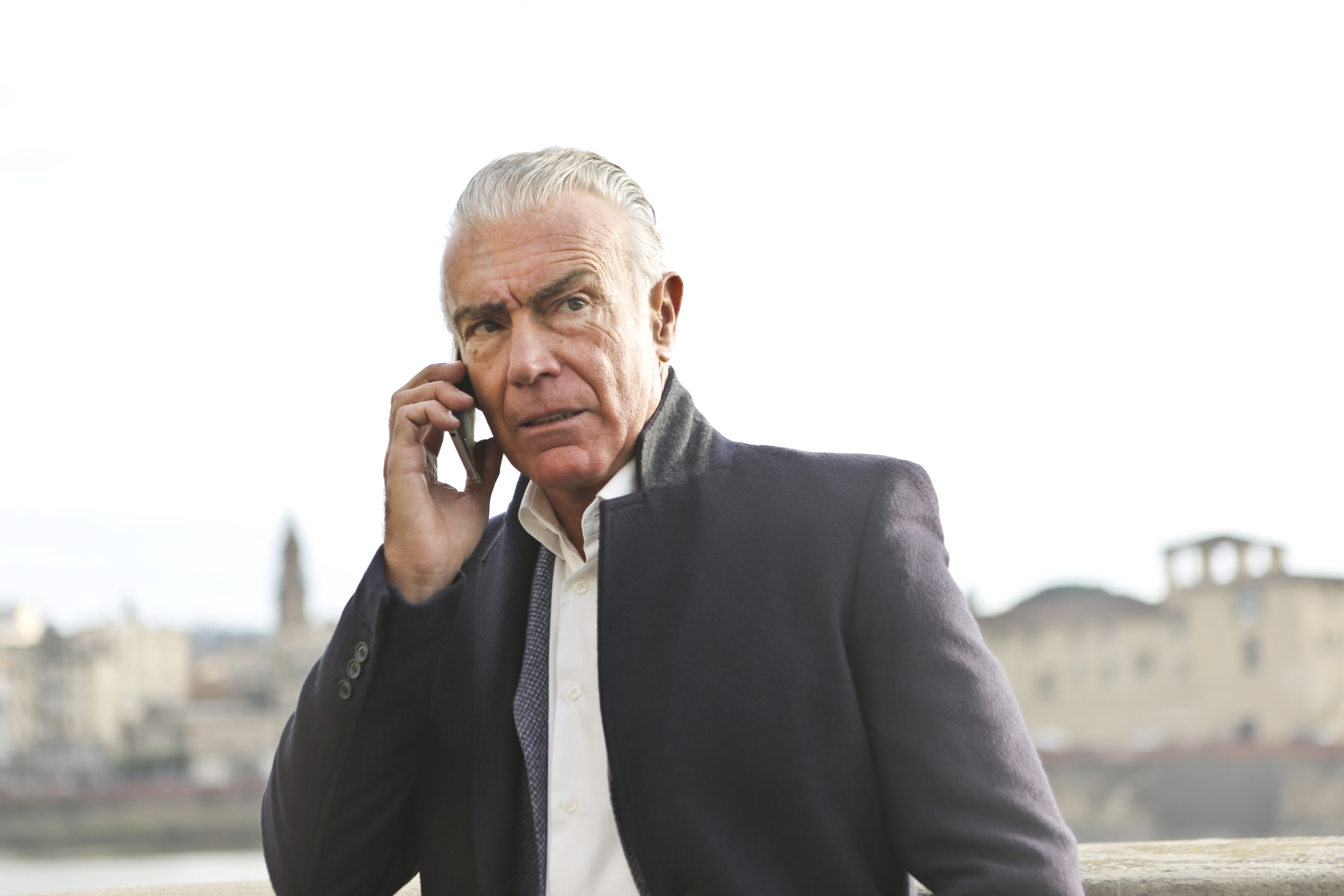 A frustrated elderly man engaged on a phonecall | Source: Pexels