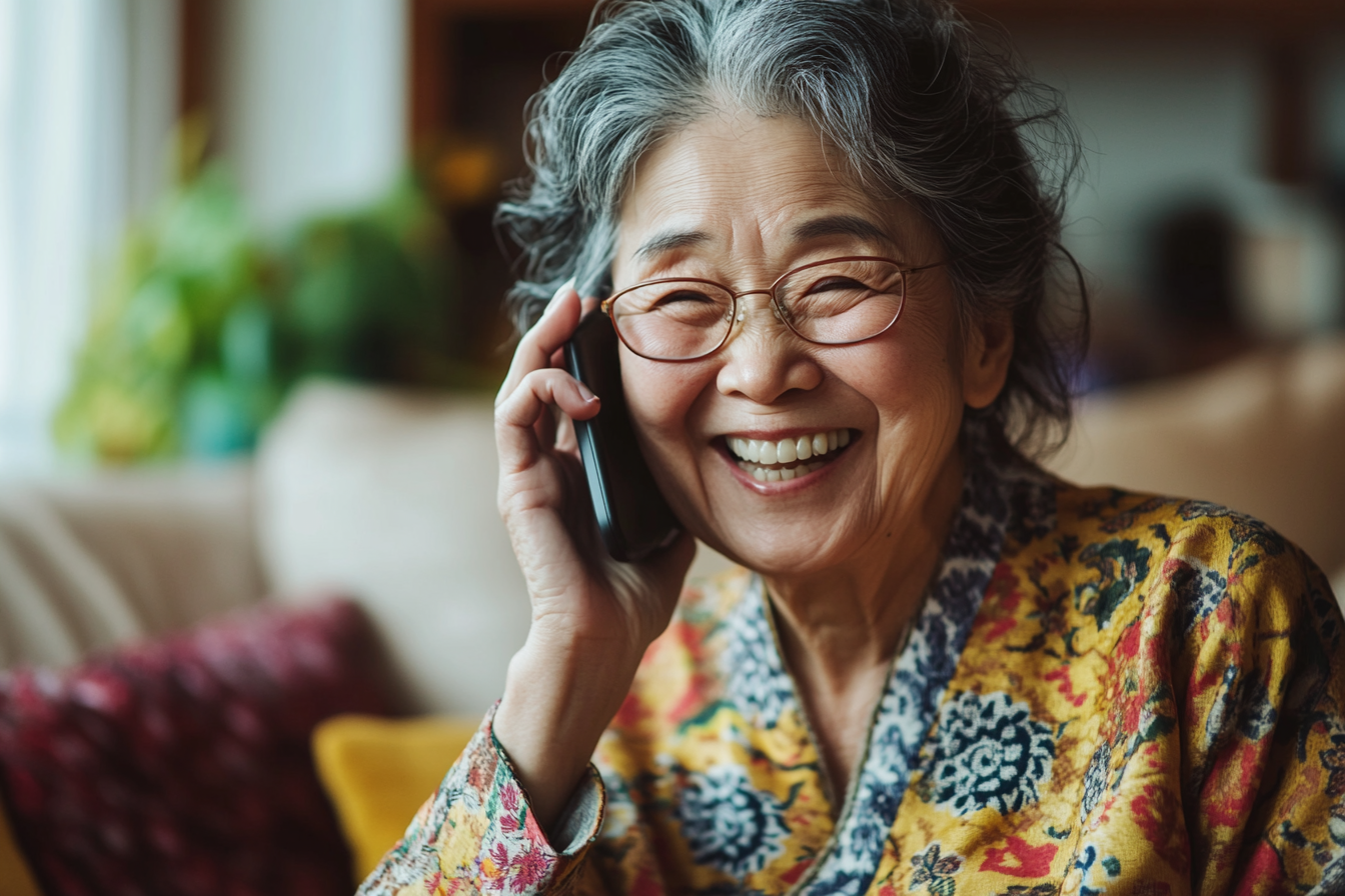 A woman laughing while speaking on her cell phone | Source: Midjourney