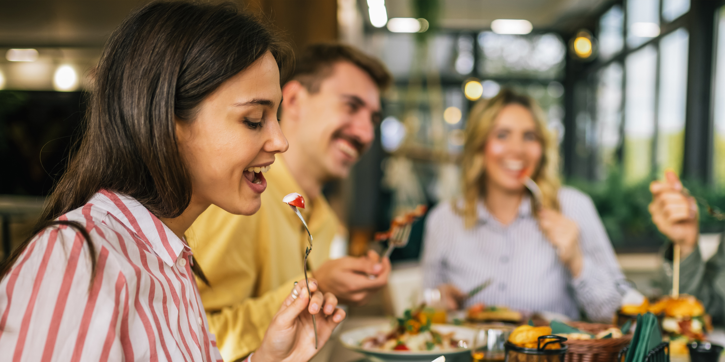 People sitting at a restaurant | Source: Shutterstock