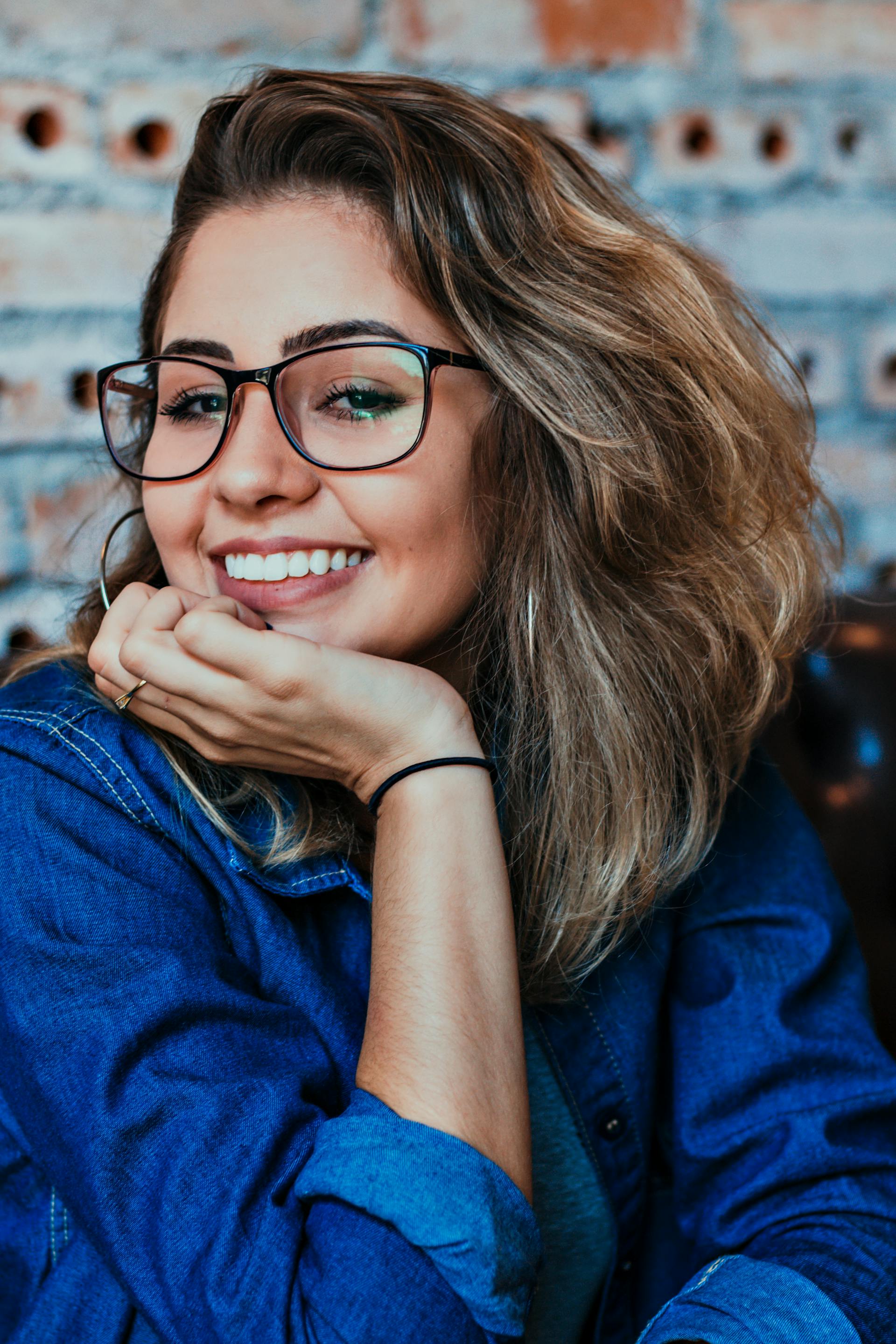 A woman smiling at someone | Source: Pexels