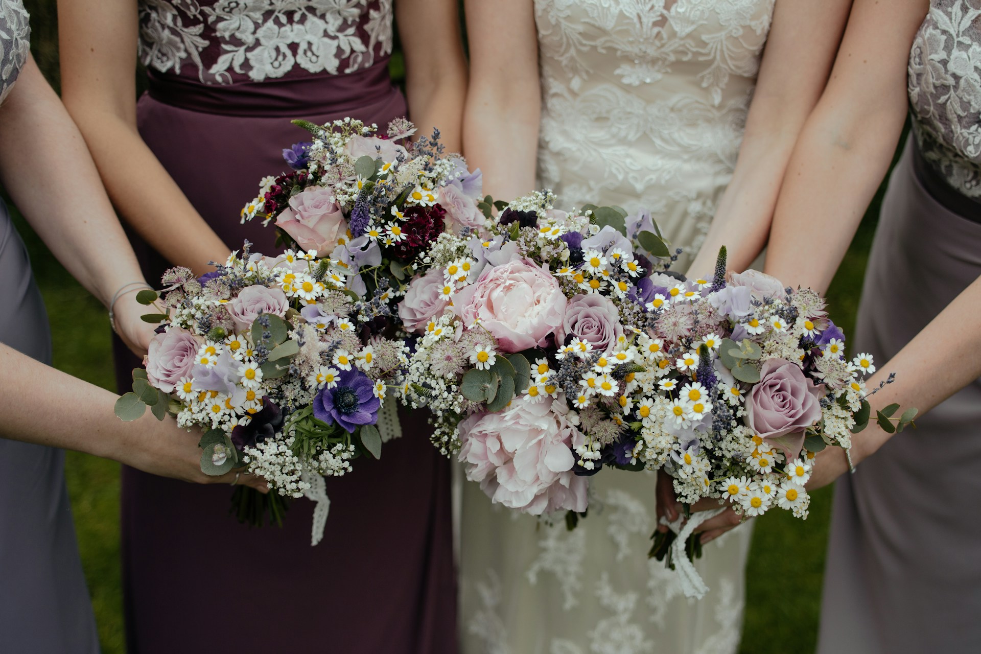 A group of bridesmaids holding a bouquet each | Source: Unsplash