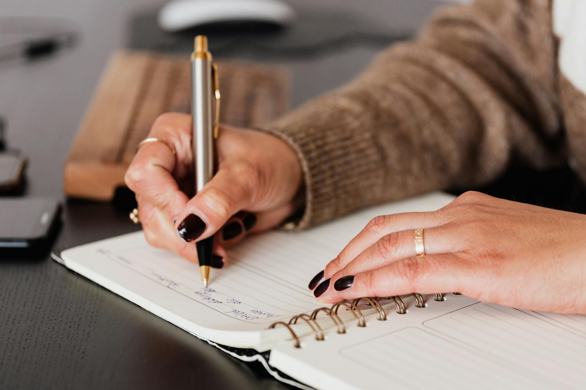 A woman writing in her diary | Source: Pexels