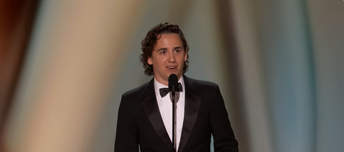 Marcello Hernández speaks onstage in a black tuxedo during the 78th Primetime Emmy Awards. | Source: YouTube/NBC and Peacock