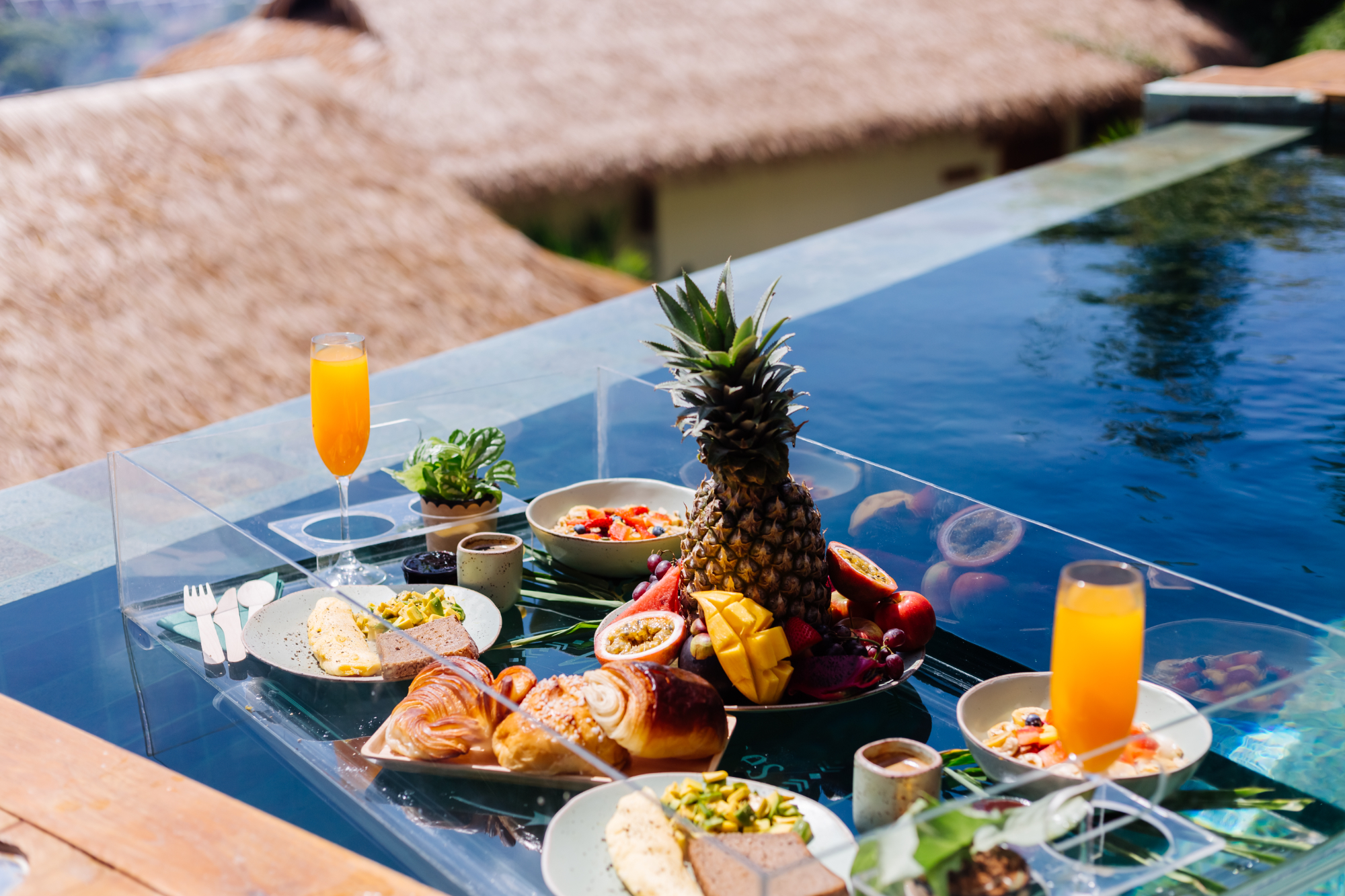 Floating breakfast on a swimming pool in a villa | Source: Freepik