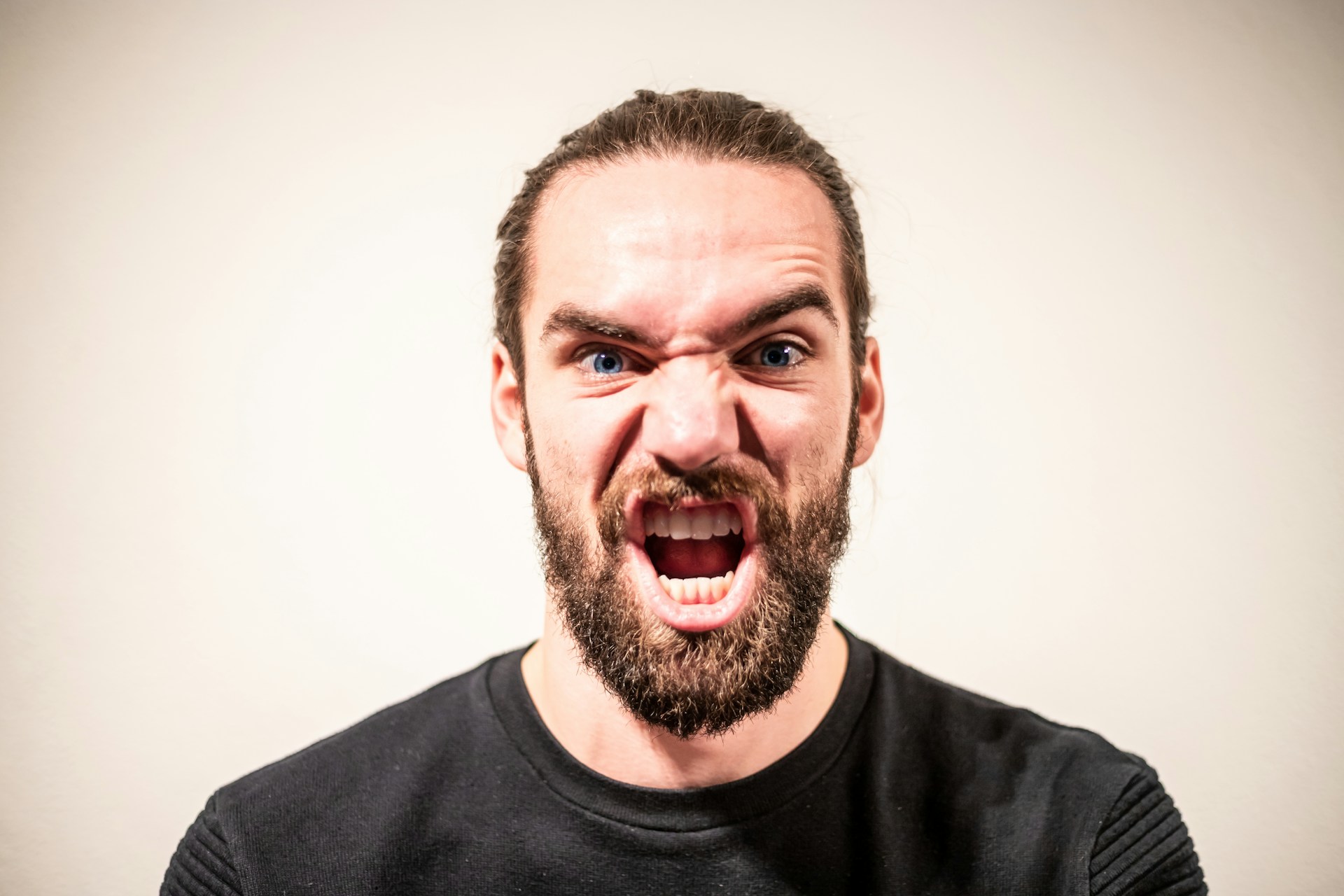 A man speaking angrily | Source: Unsplash