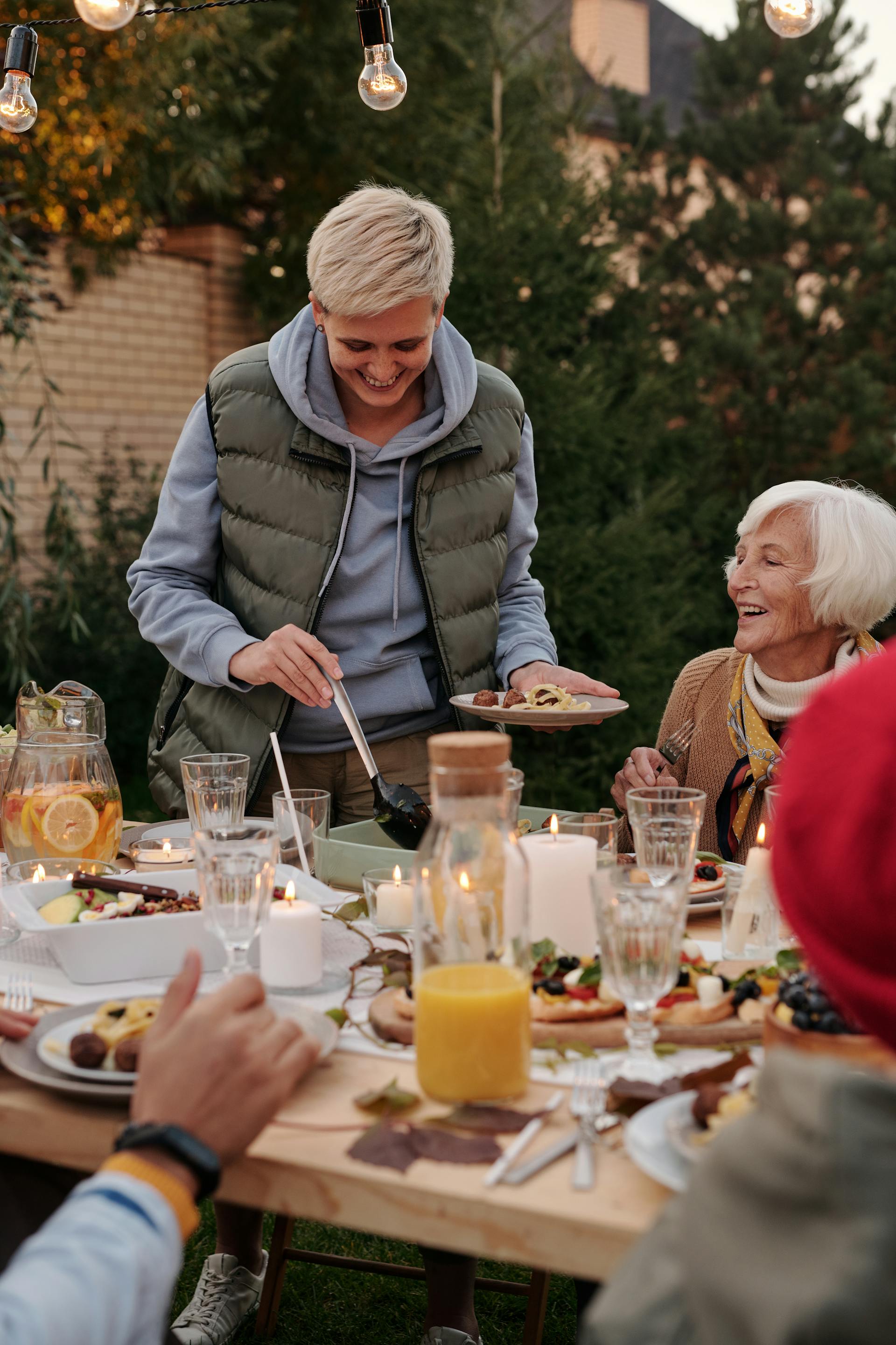 People at a barbecue laughing together | Source: Pexels