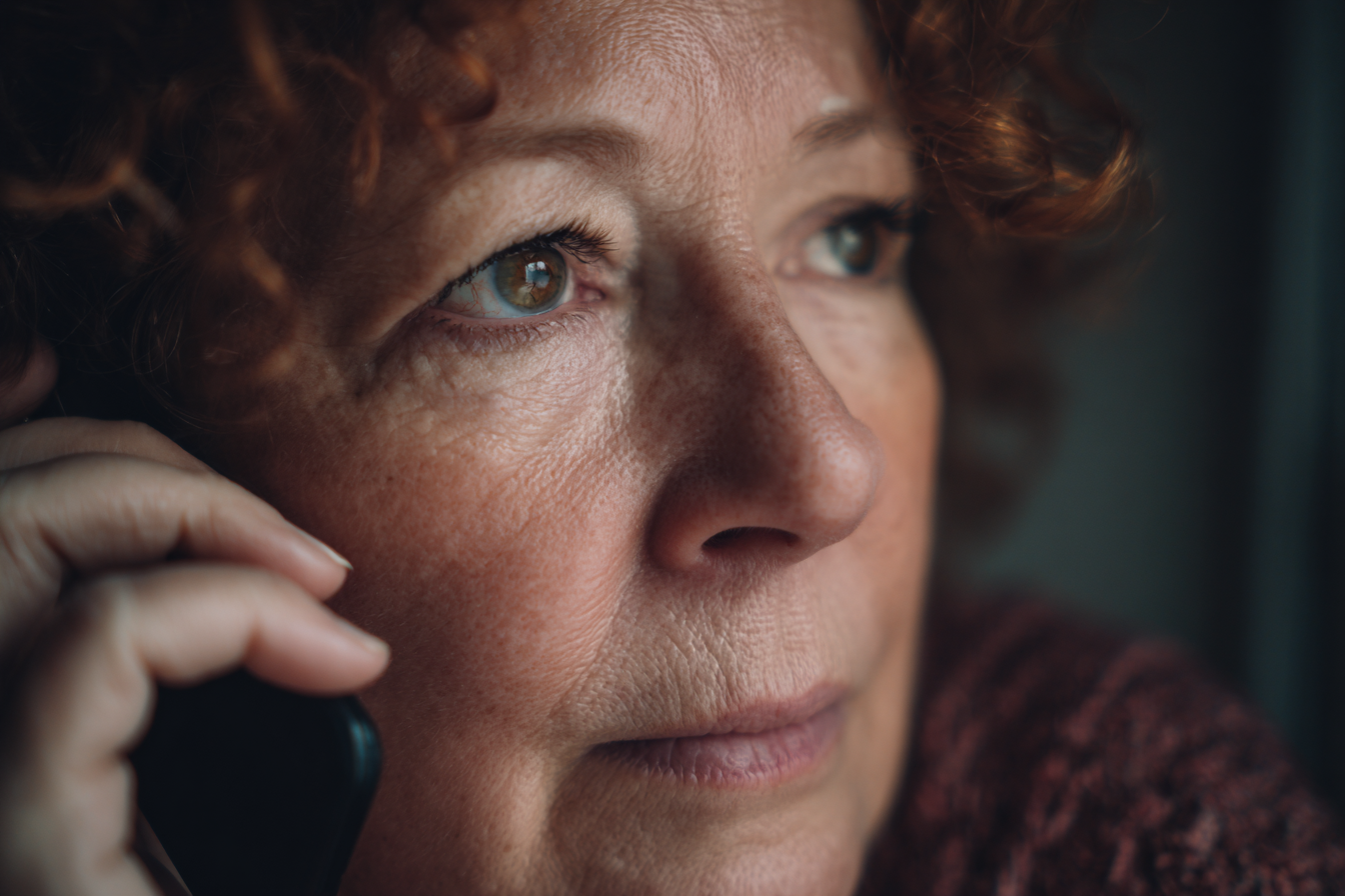 A woman talking on the phone | Source: Midjourney