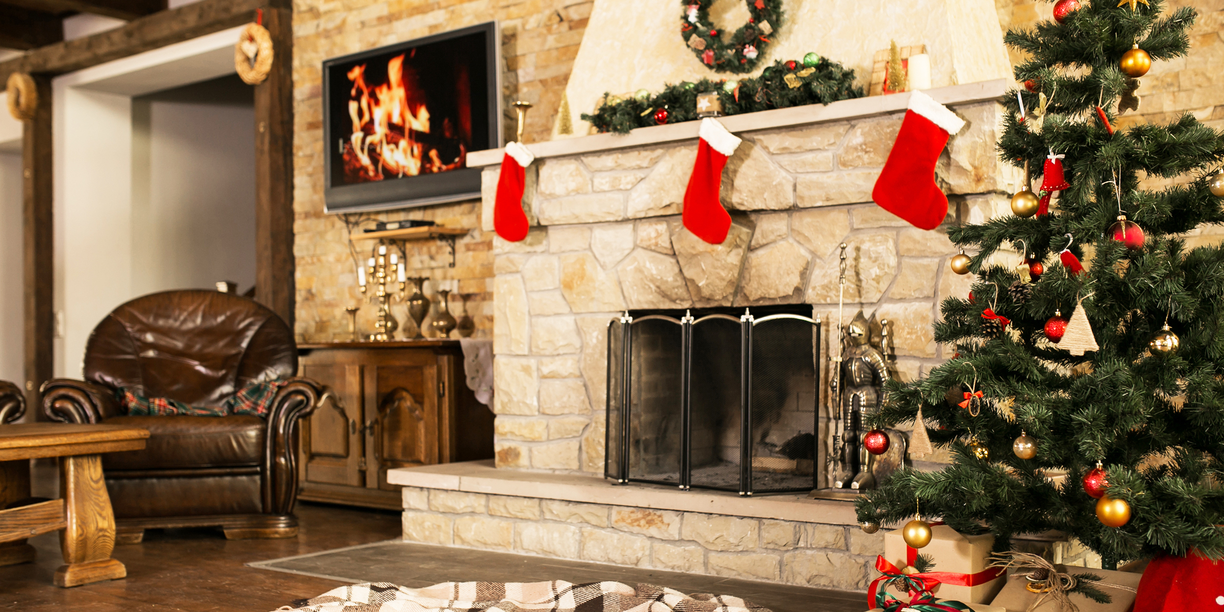 A Christmas tree by the fireplace | Source: Shutterstock