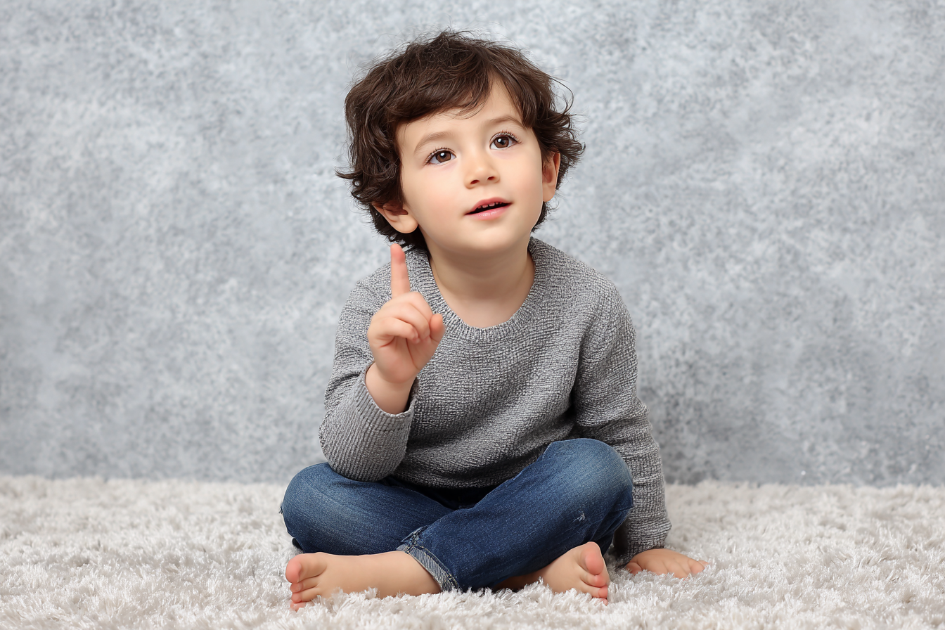 A boy pointing his finger while speaking | Source: Midjourney