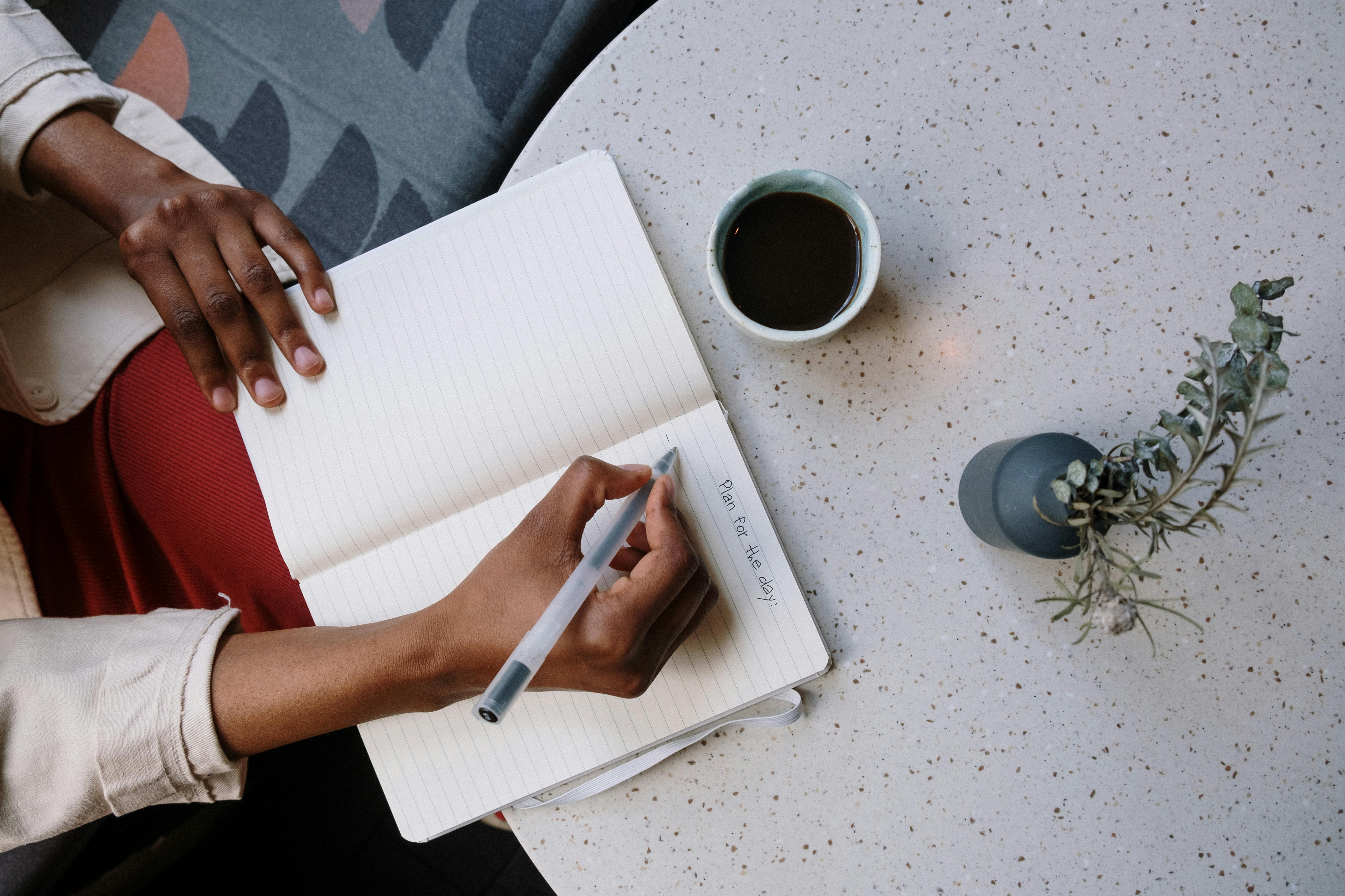 A woman writing something | Source: Pexels