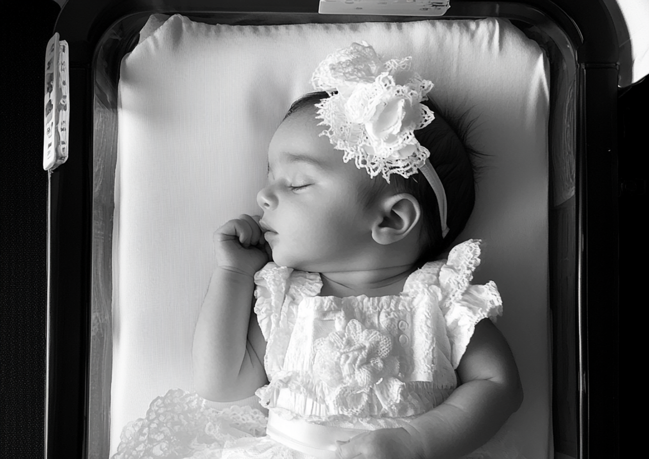 A sleeping baby girl | Source: Midjourney