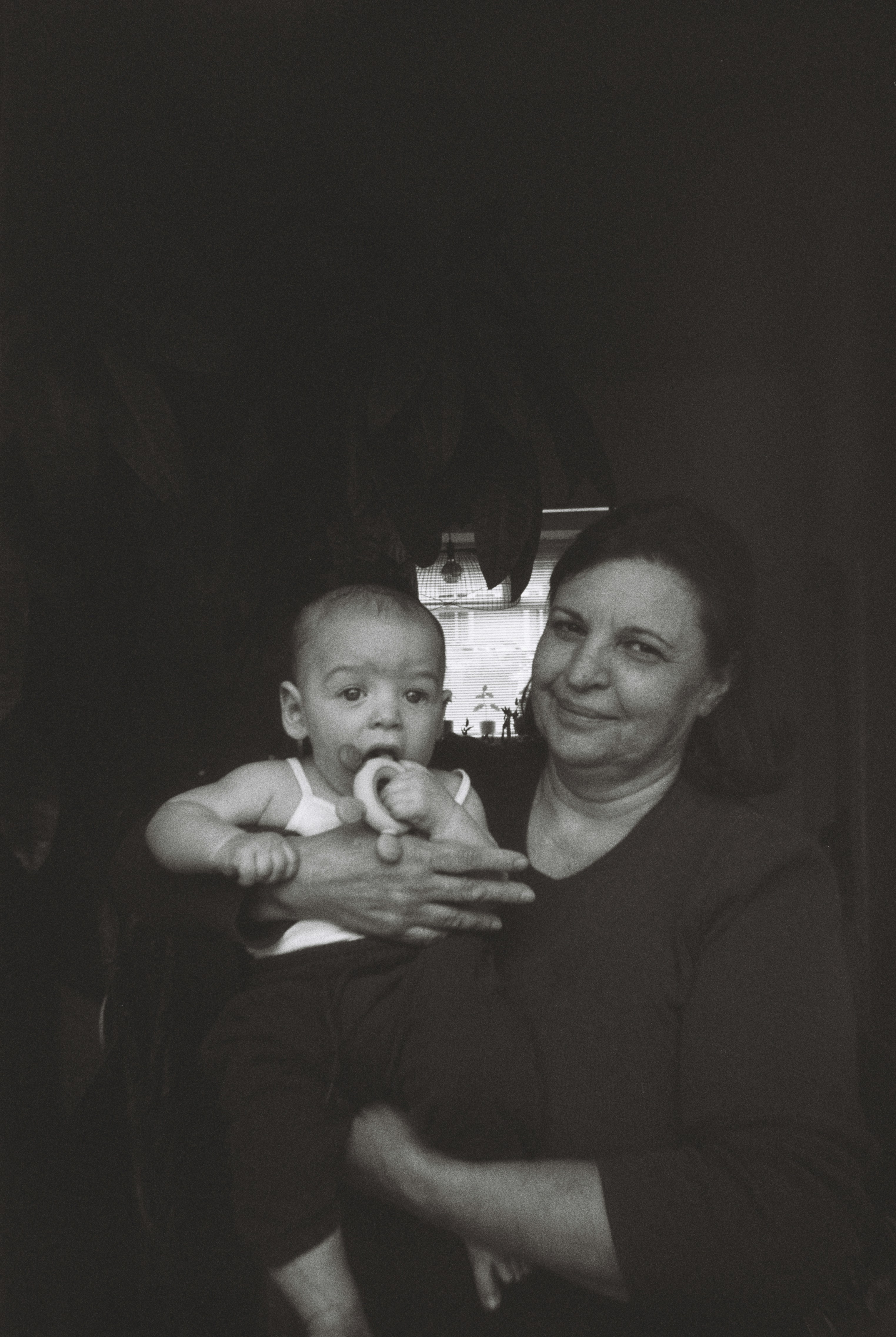A woman holding a baby in her arms | Source: Unsplash