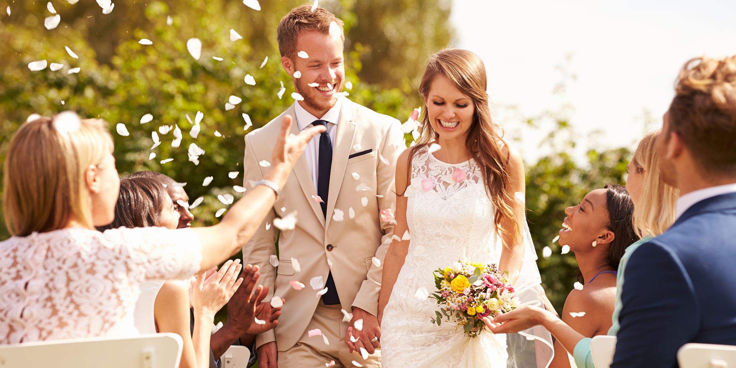 A smiling newlywed couple | Source: Shutterstock