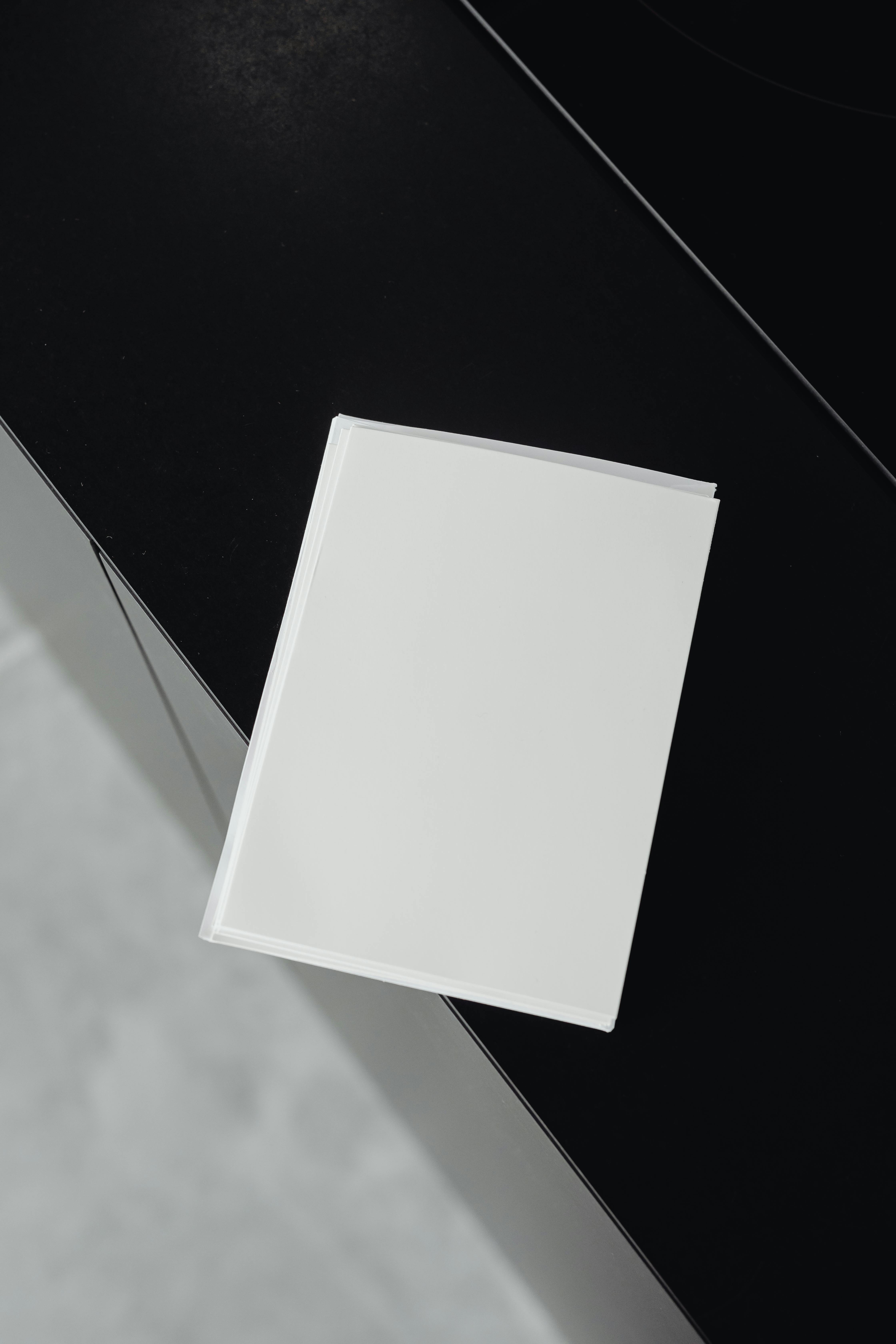 Sheets of paper on a table | Source: Pexels