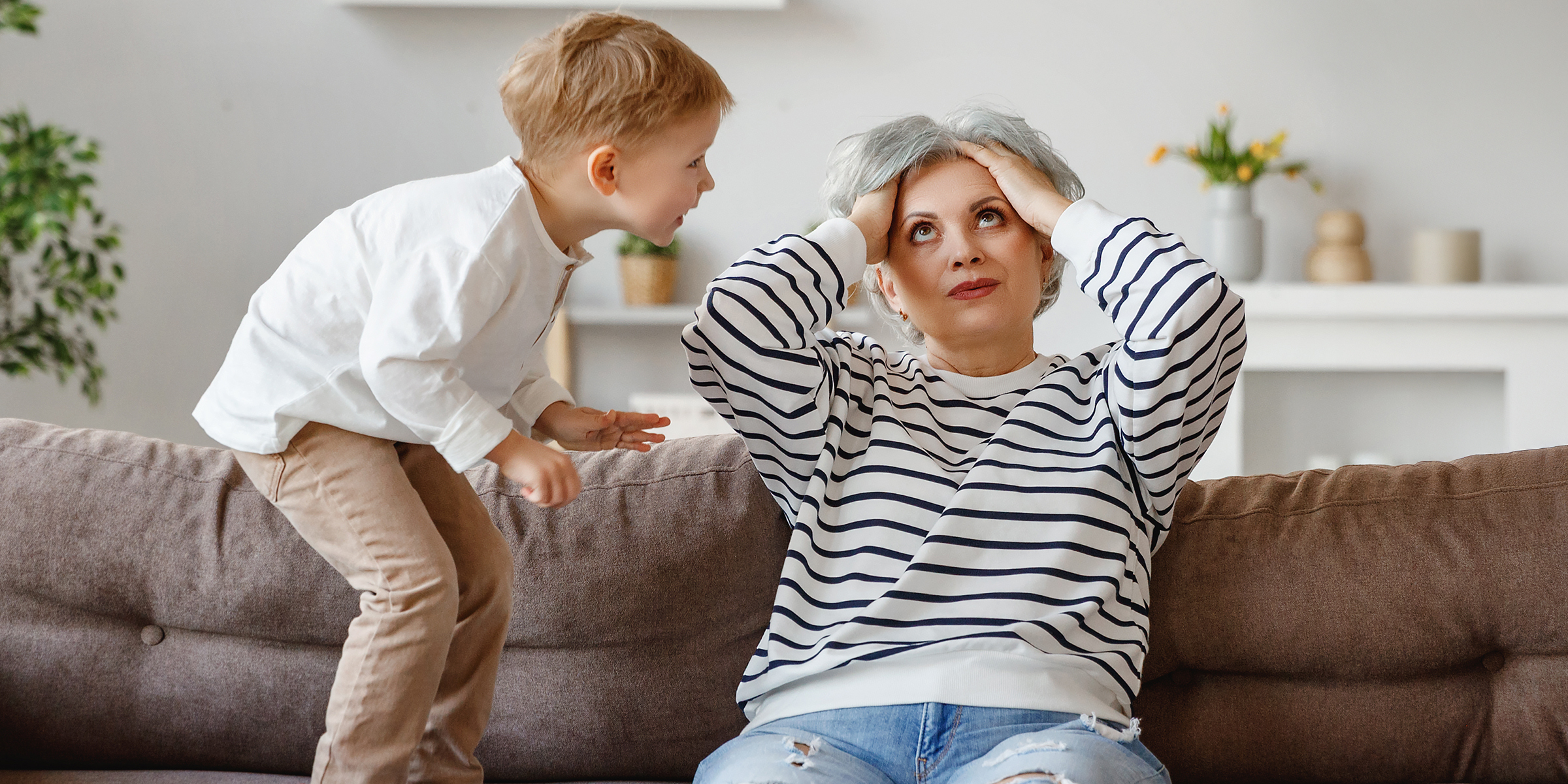 A frustrated woman and a young boy | Source: Shutterstock