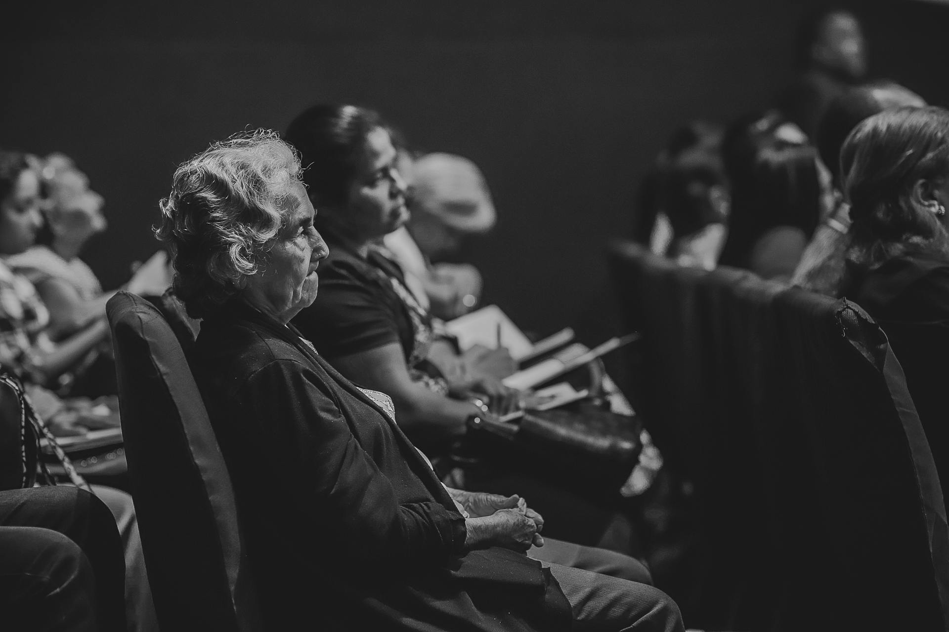 A group of grieving people sitting on chairs | Source: Pexels
