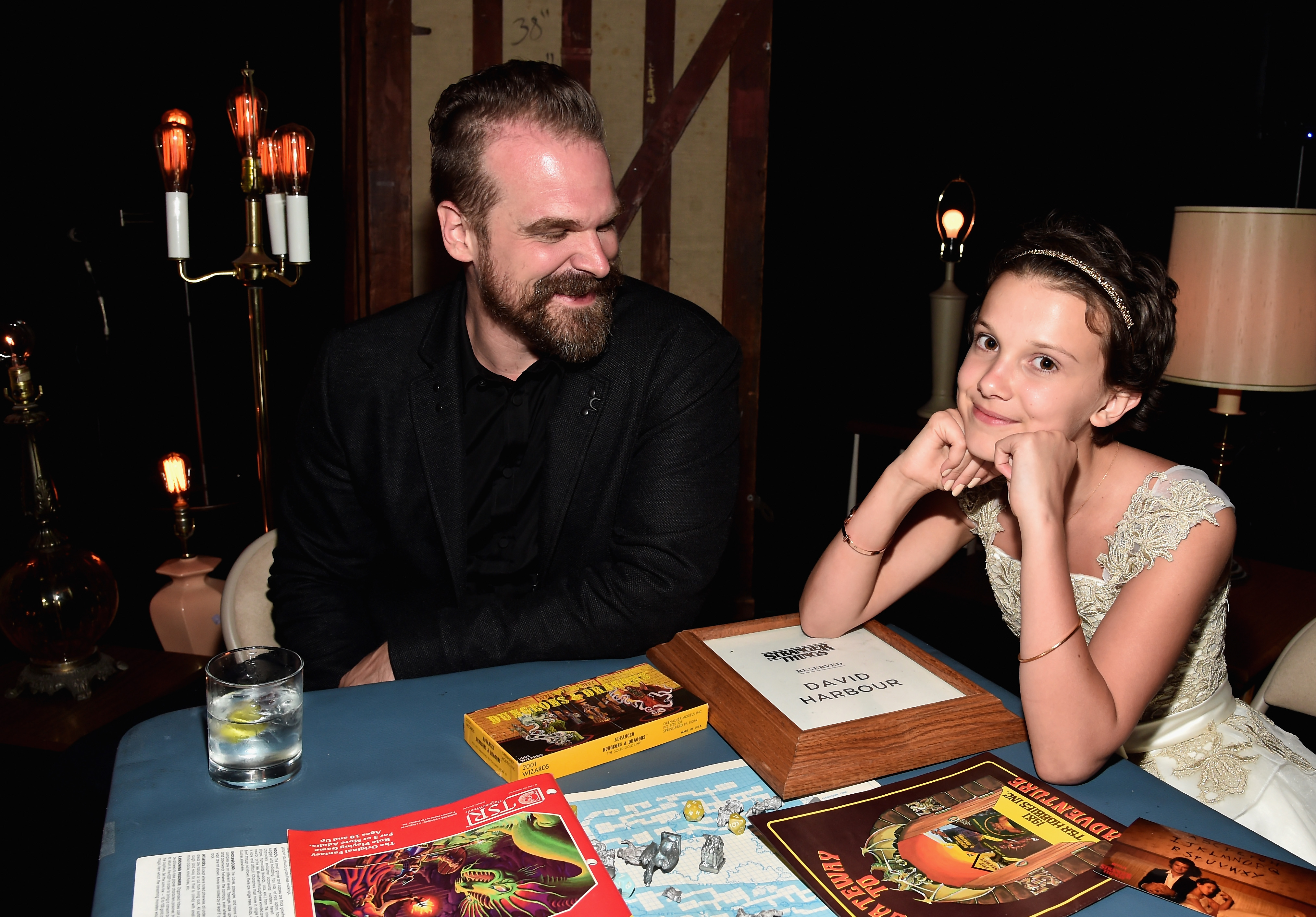 David Harbour and Millie Brown attend the after party for the premiere of Netflix's "Stranger Things" at Mack Sennett Studios on July 11, 2016, in Los Angeles, California. | Source: Getty Images