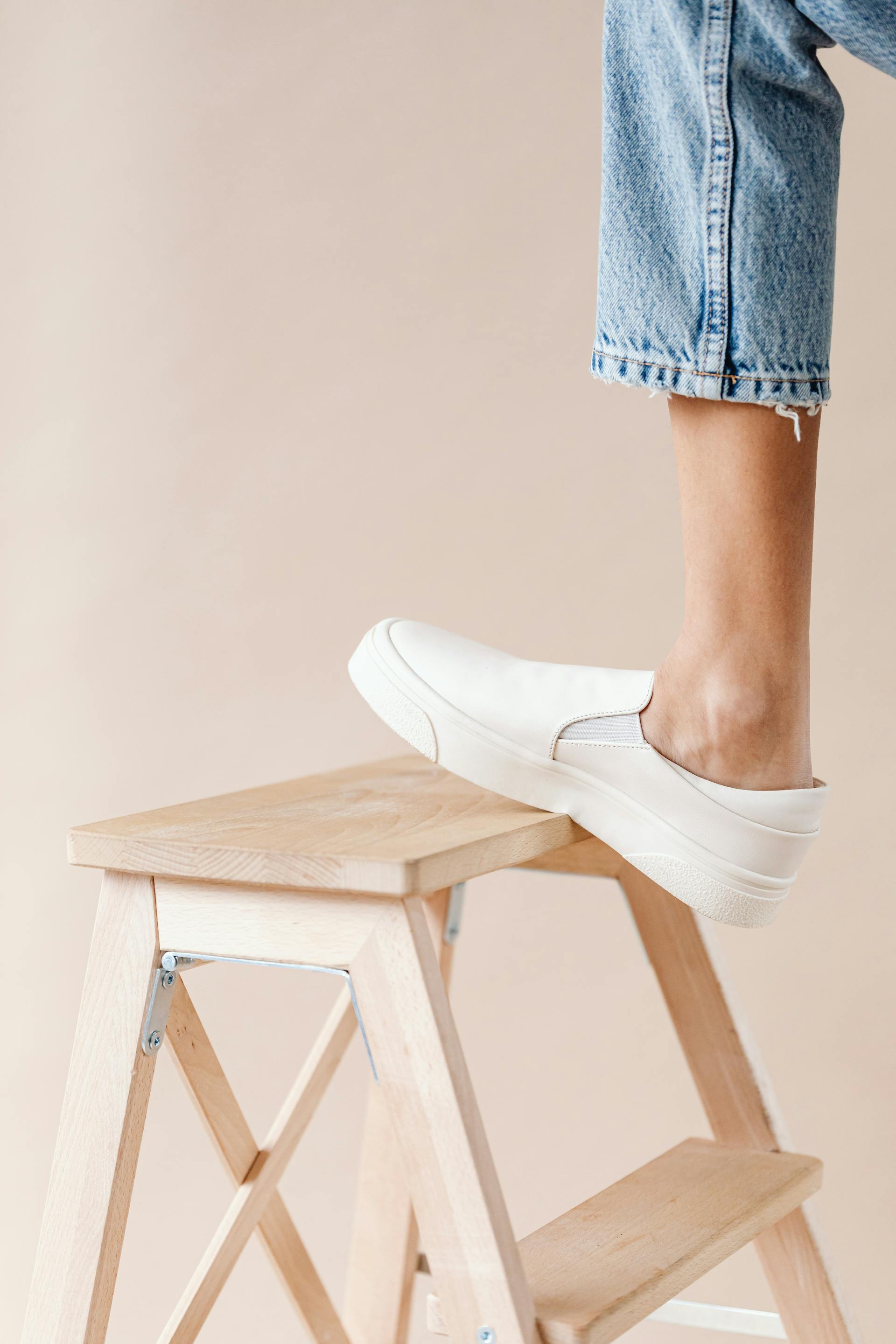 A woman's foot on a ladder | Source: Pexels