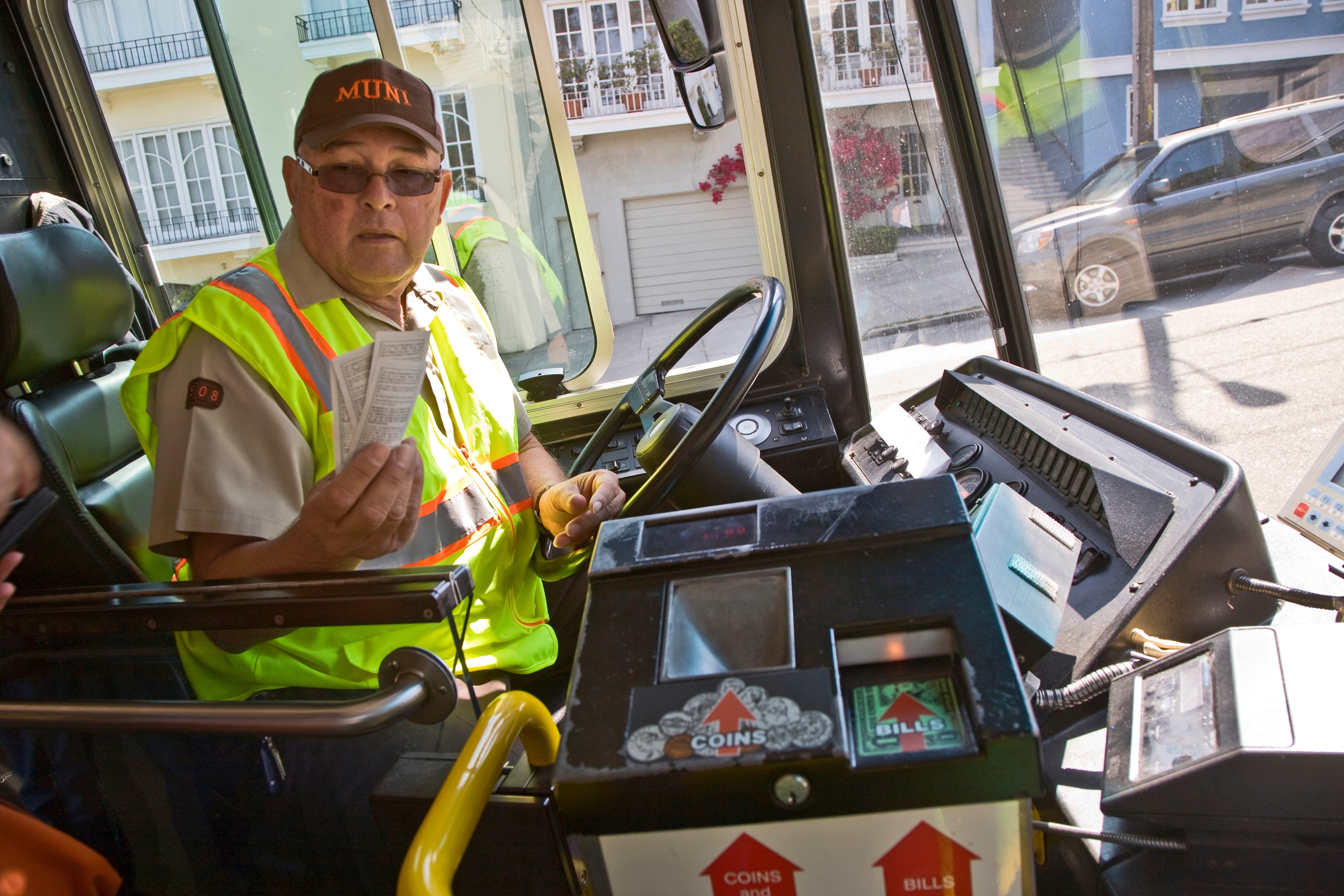 An old bus driver behind the wheel | Source: Shutterstock