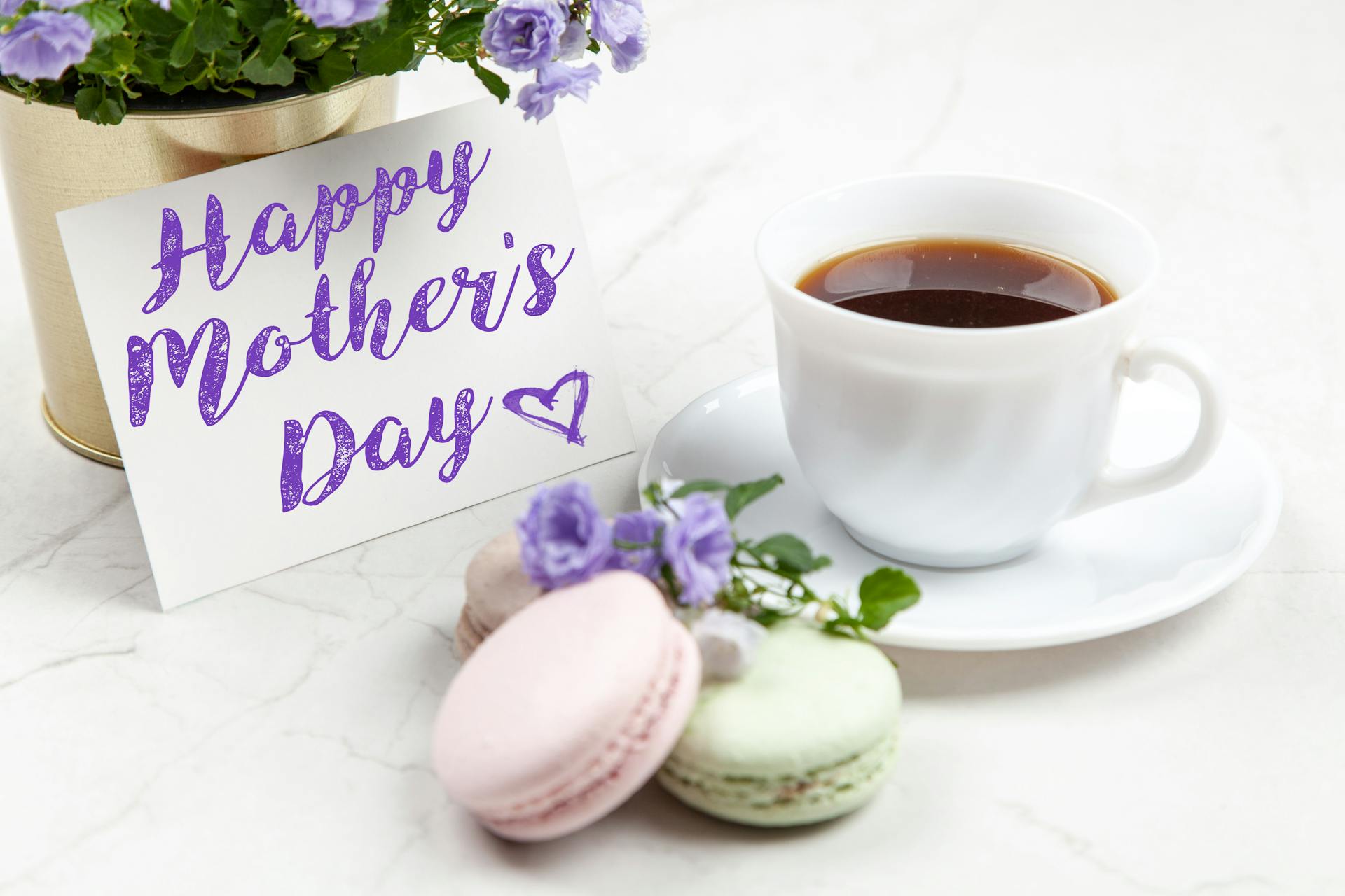 A Mother's Day card beside a ceramic cup | Source: Pexels