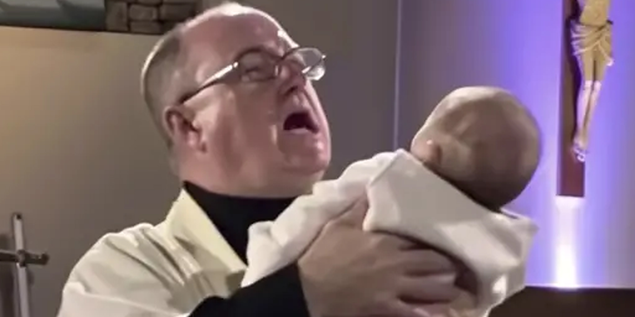 A shocked priest holding a baby | Source: Amomama