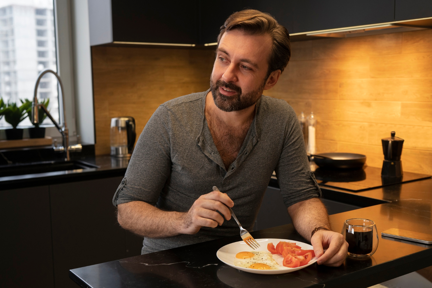 A delighted man eating his meal | Source: Freepik