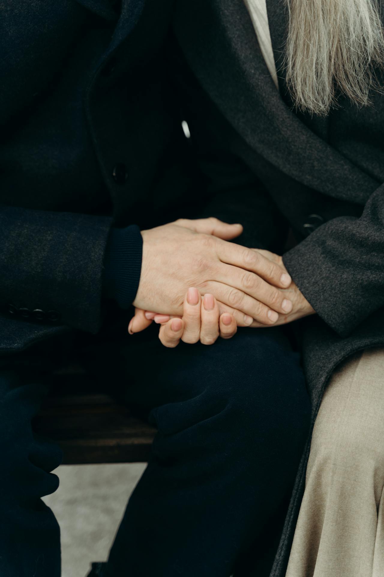 A senior couple holding hands | Source: Pexels