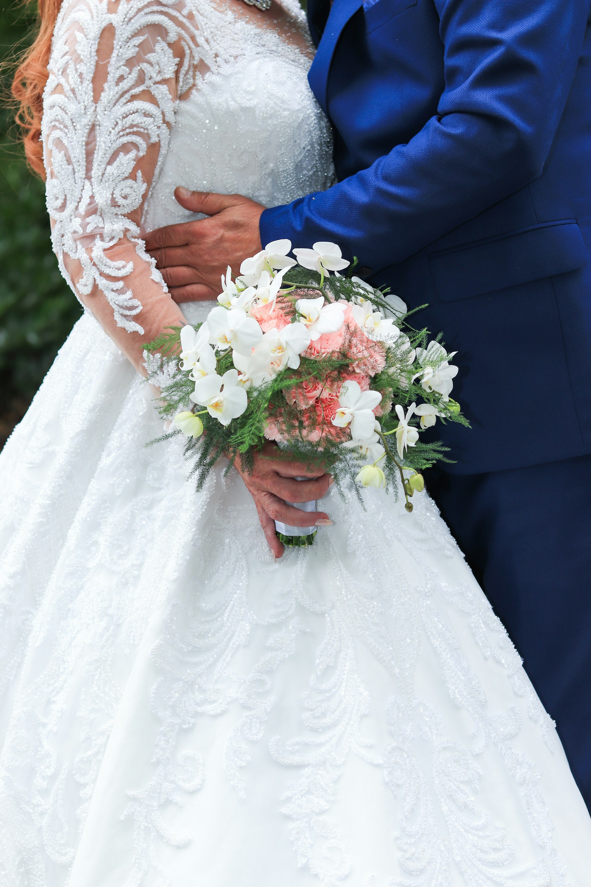A groom embracing his bride | Source: Unsplash
