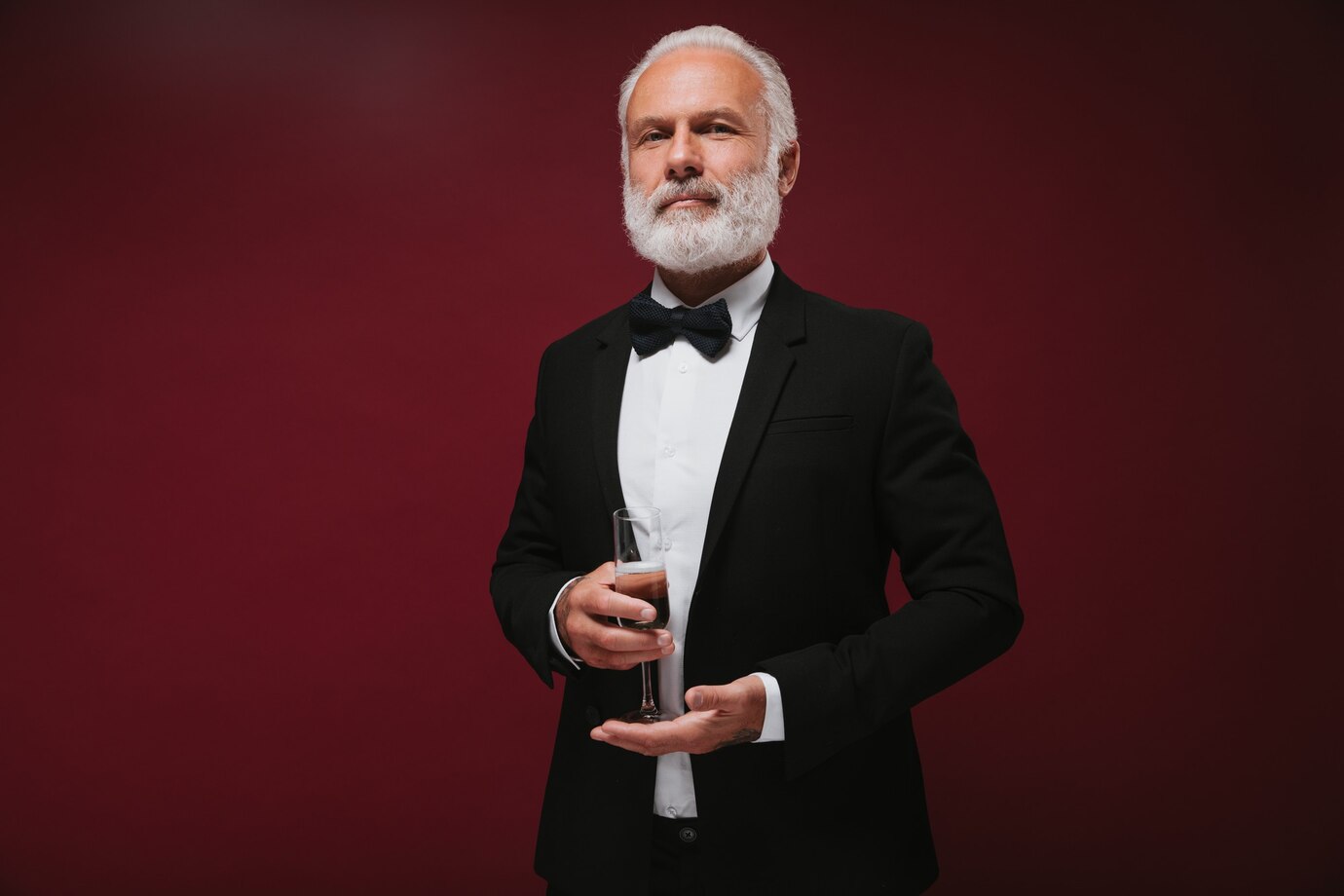A man with a glass of wine | Source: Freepik