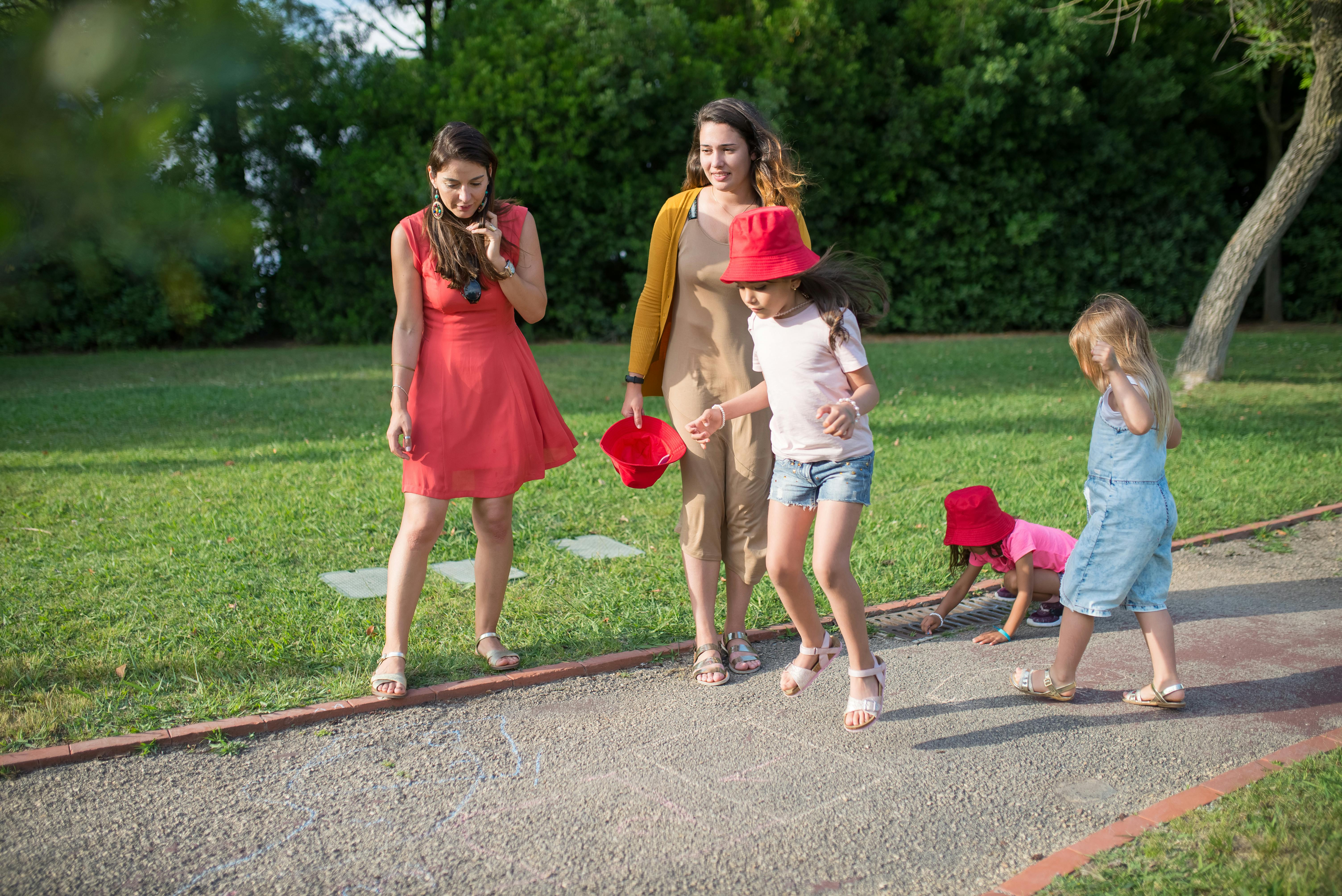 Women and children playing | Source: Pexels