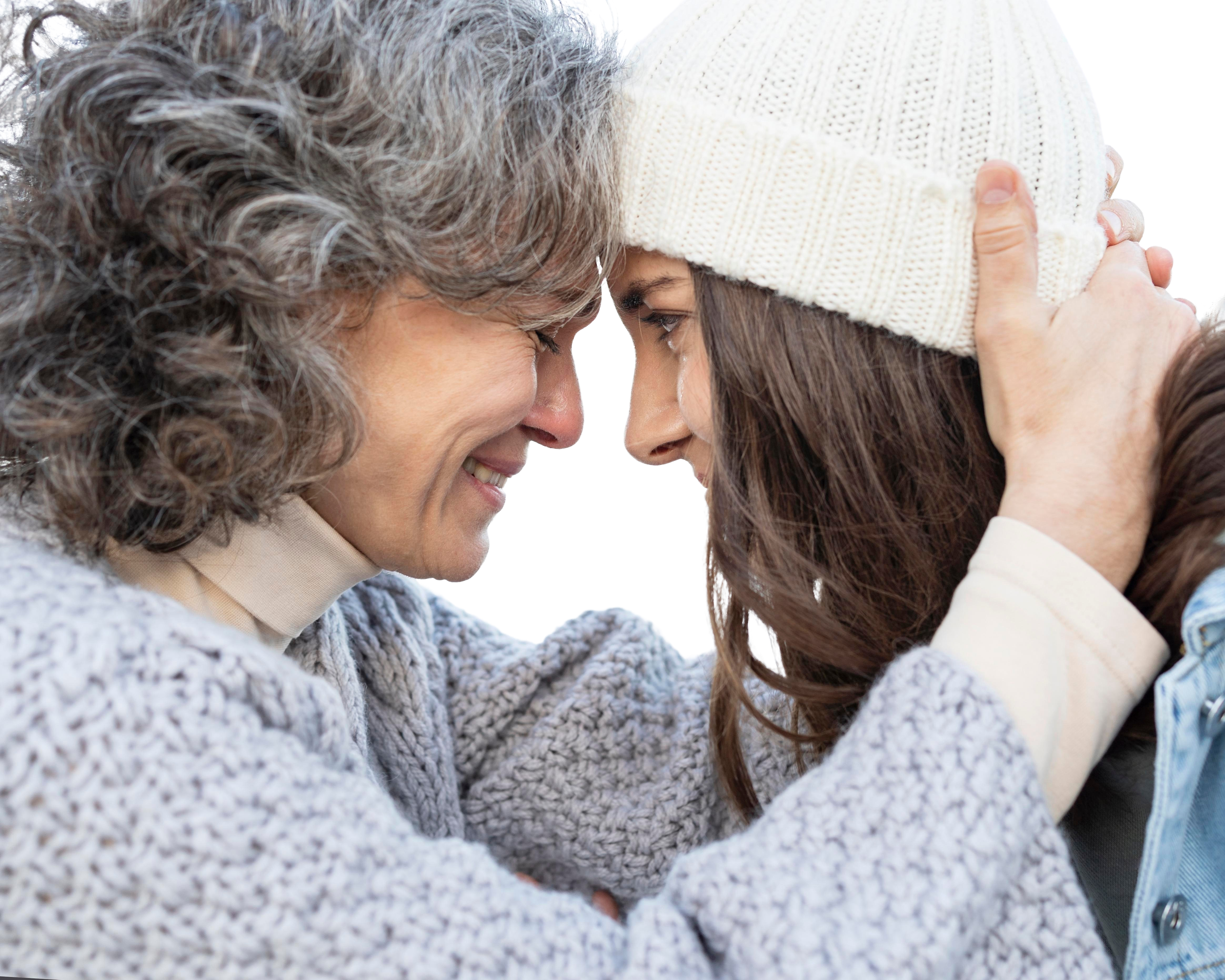 Grandmother and granddaughter hugging | Source: Freepik