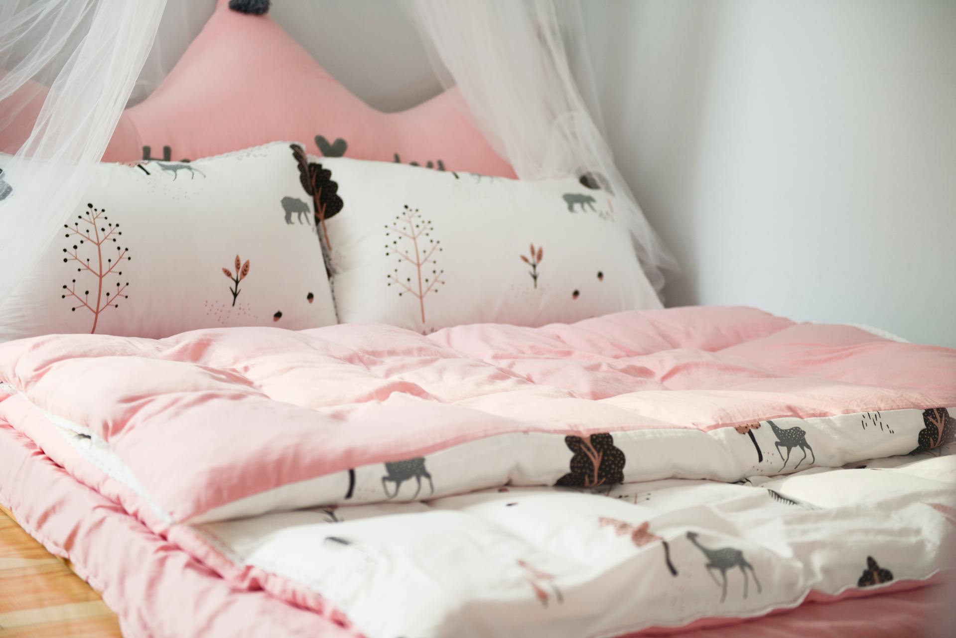 Printed bedcovers on a bed | Source: Pexels