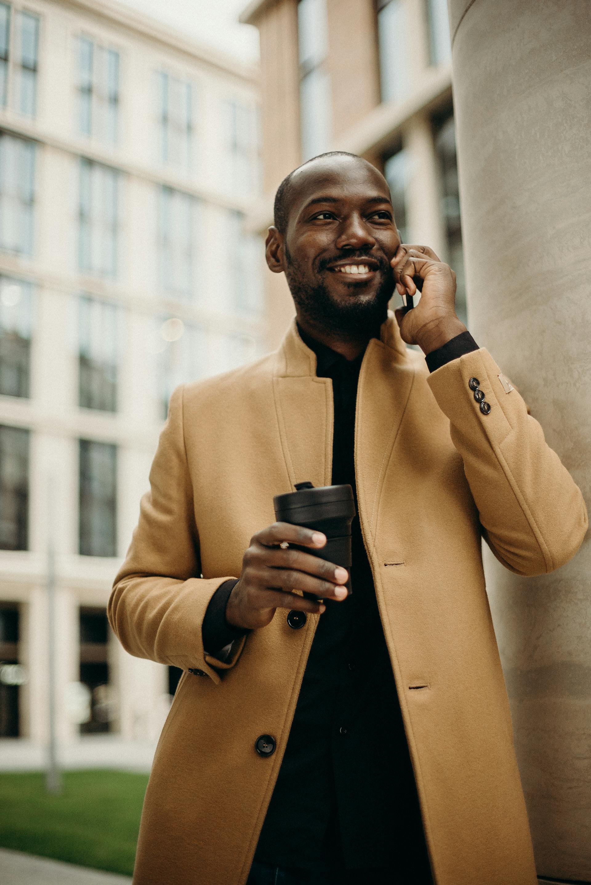 A happy man speaking on his cell phone | Source: Pexels