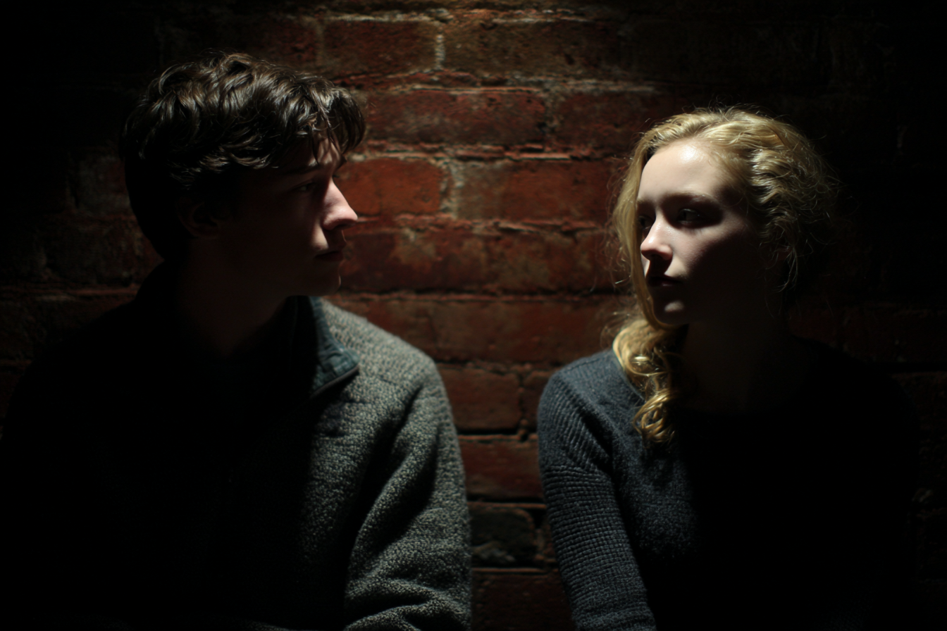 A man and woman looking at each other uncertainly | Source: Midjourney