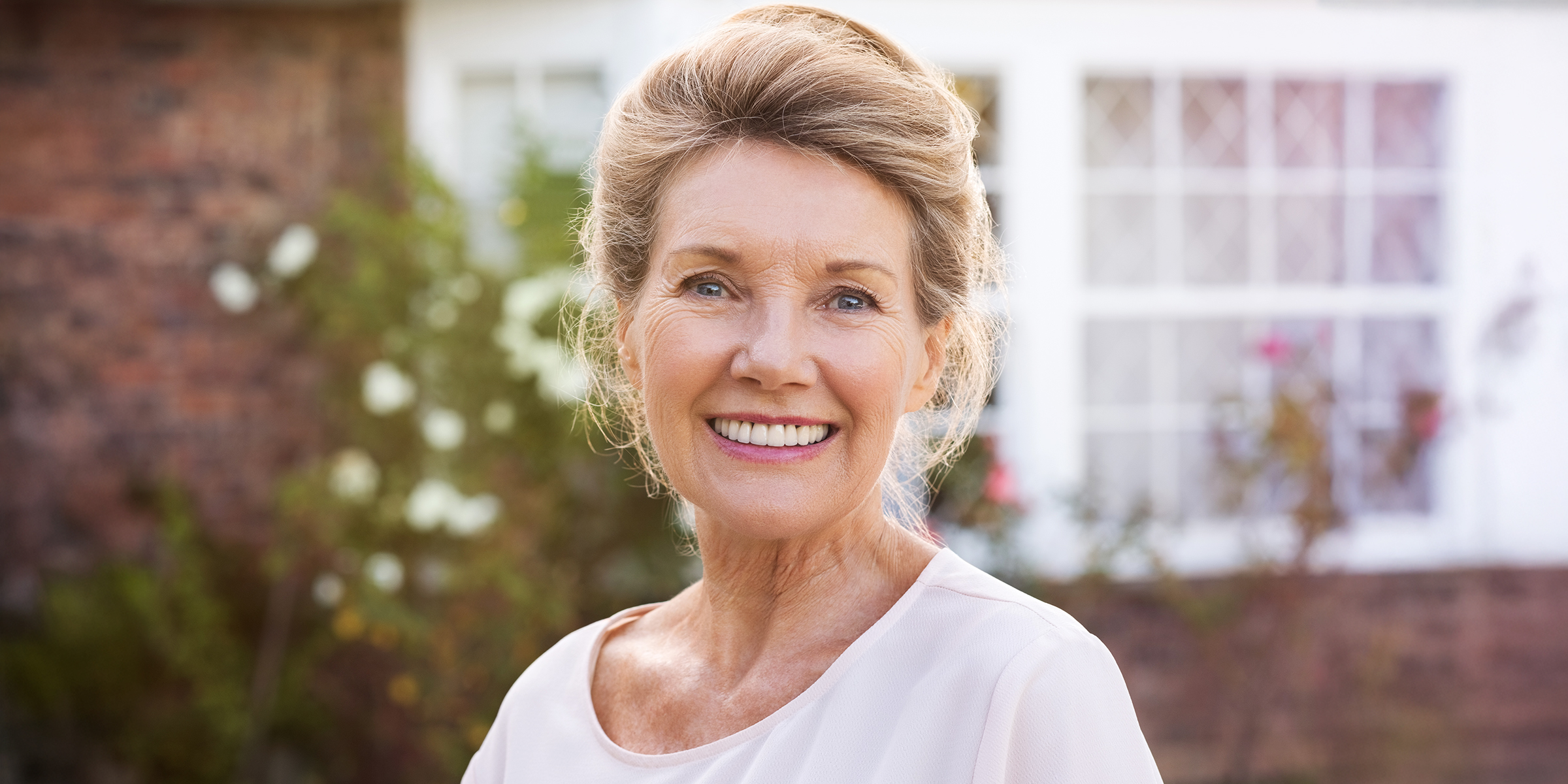 A smiling old woman | Source: Shutterstock