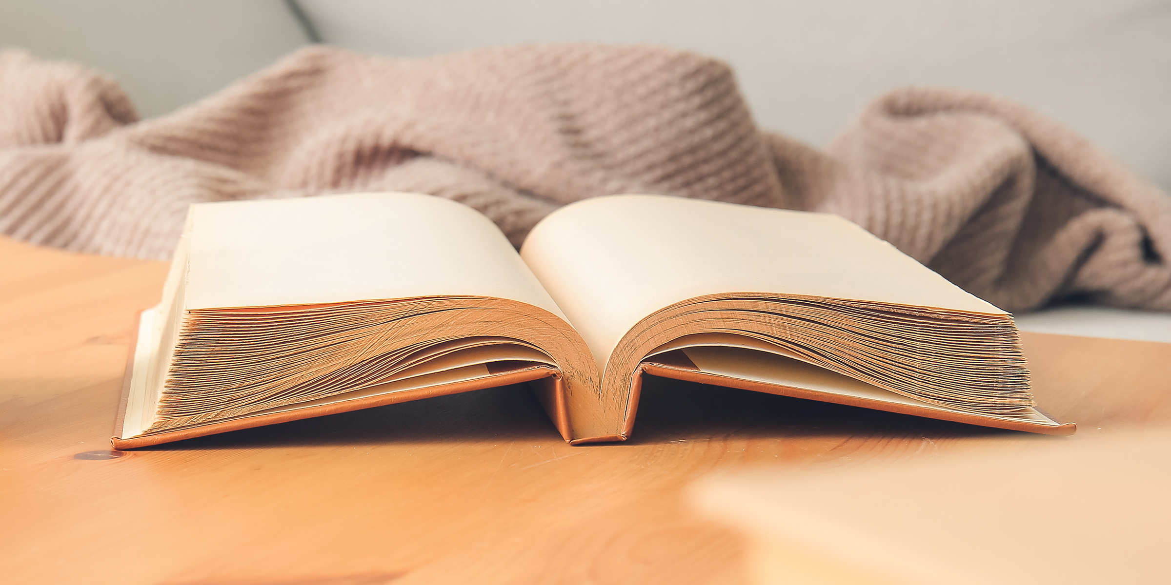 An open book on a table | Source: Shutterstock