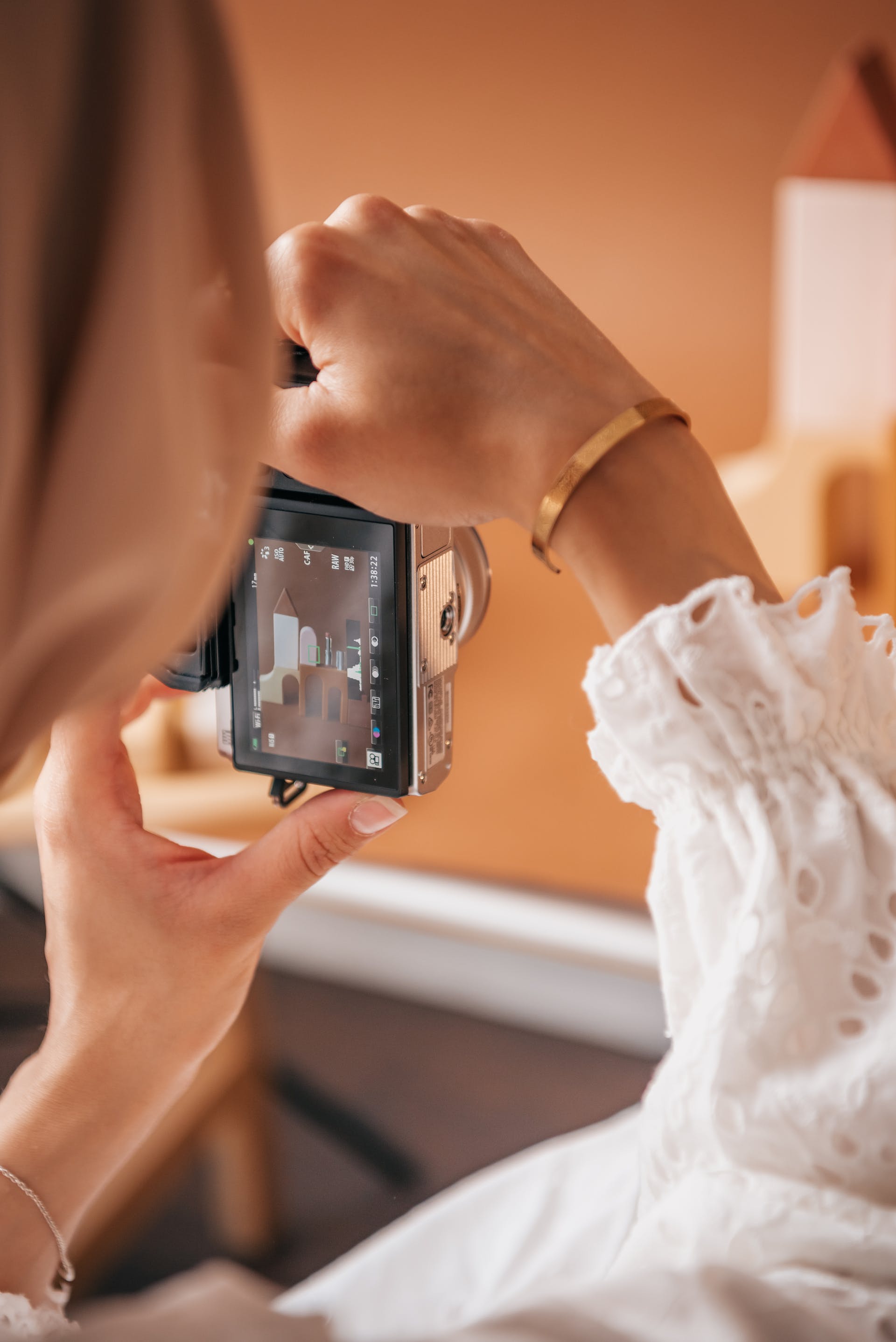 Person holding a camera | Source: Pexels