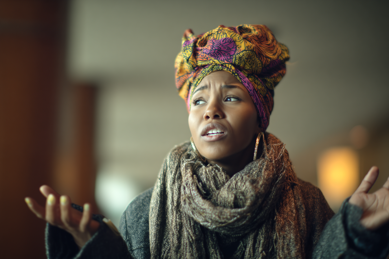A woman in a hotel lobby | Source: Midjourney