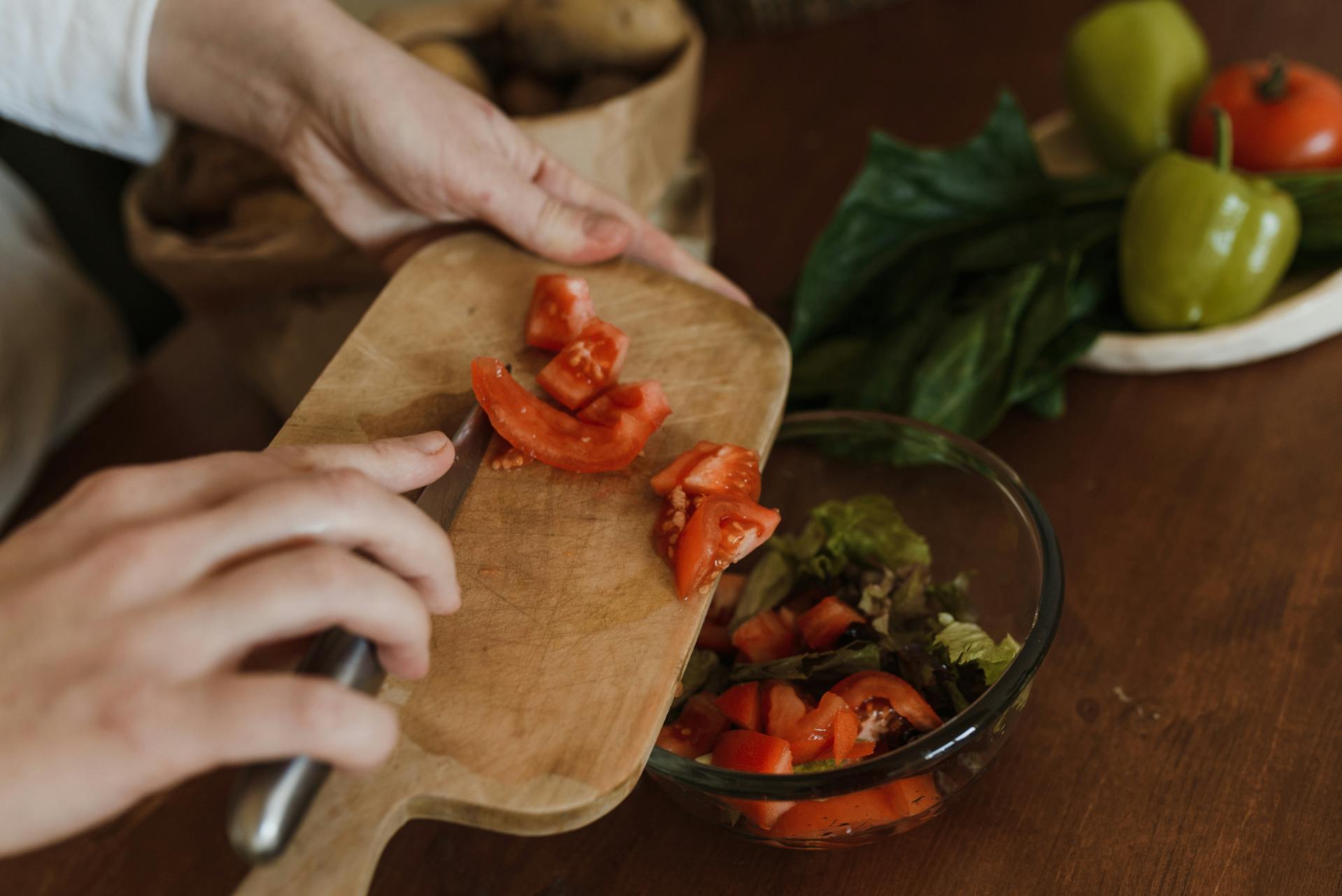 A woman preparing ingredients in a kitchen | Source: Midjourney