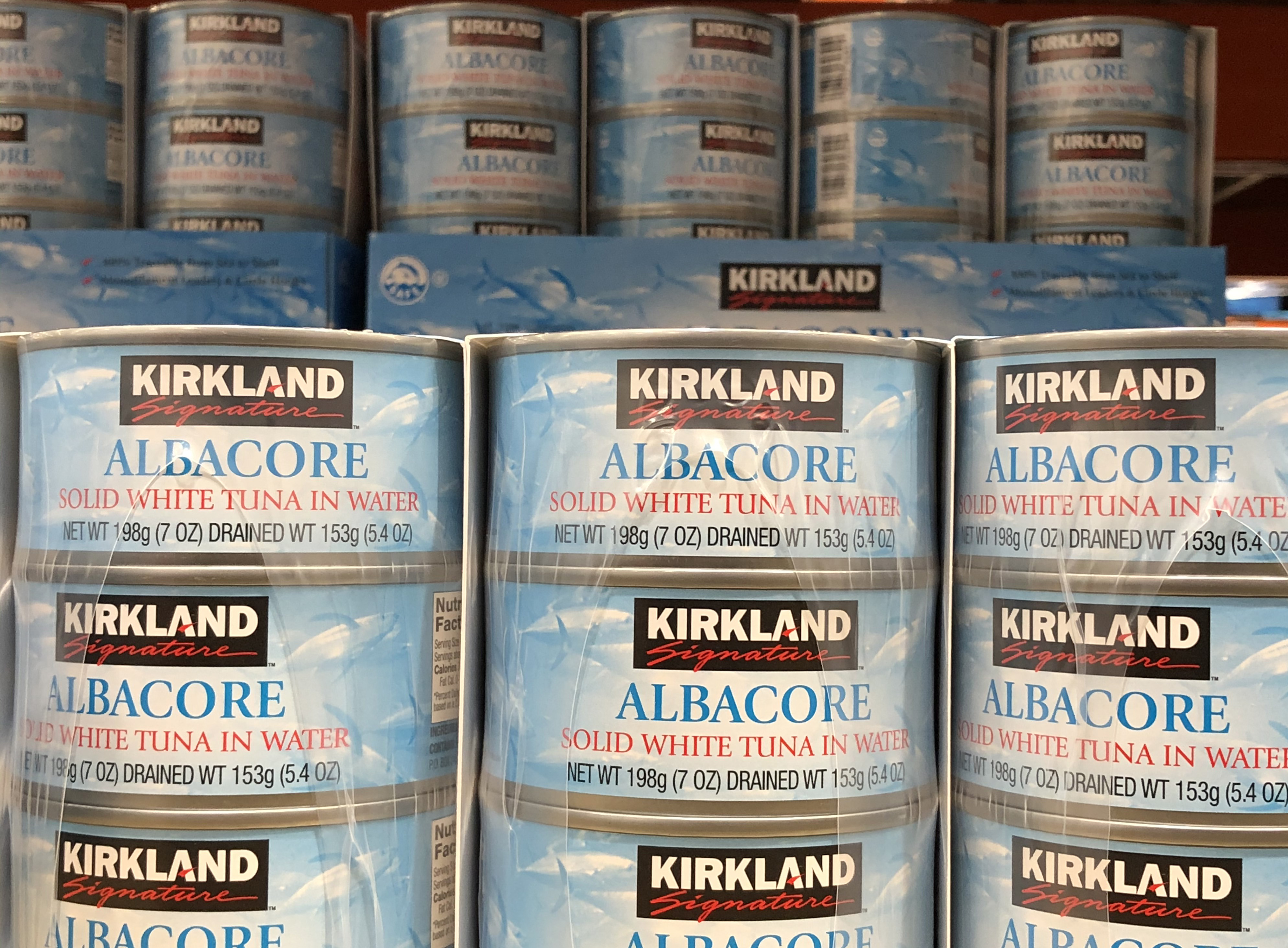 Cans of Kirkland brand albacore tune are displayed at a Costco store in Novato, California, on December 12, 2019 | Source: Getty Images