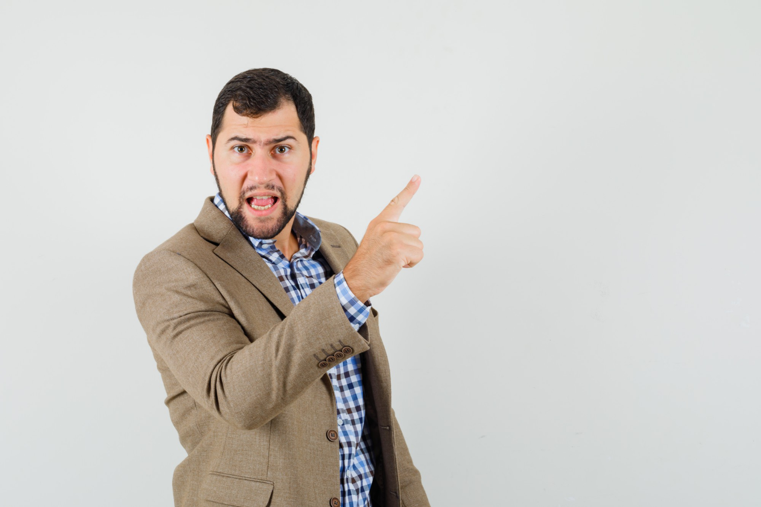 An angry man pointing his finger | Source: Freepik