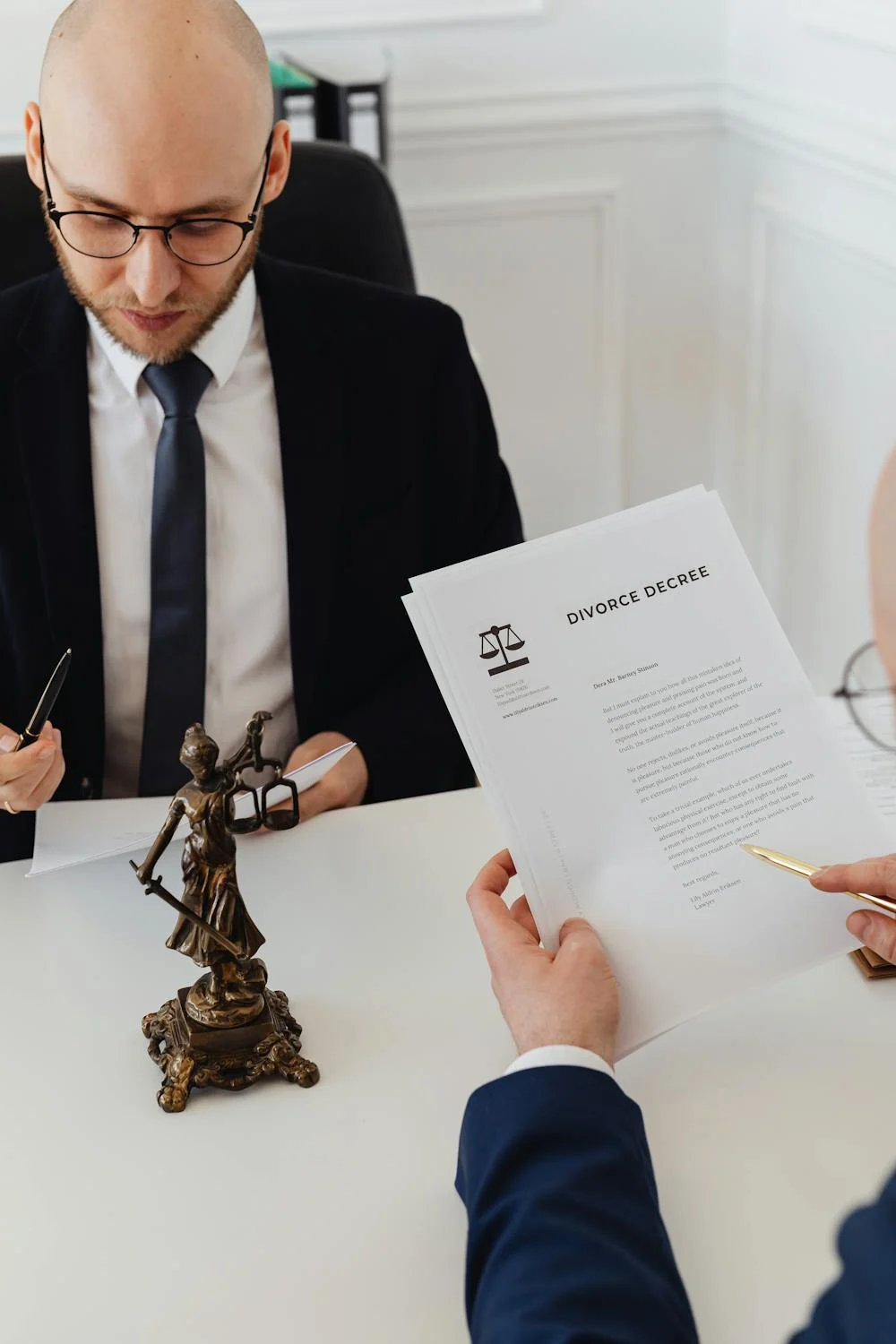 Signing divorce papers | Source: Pexels