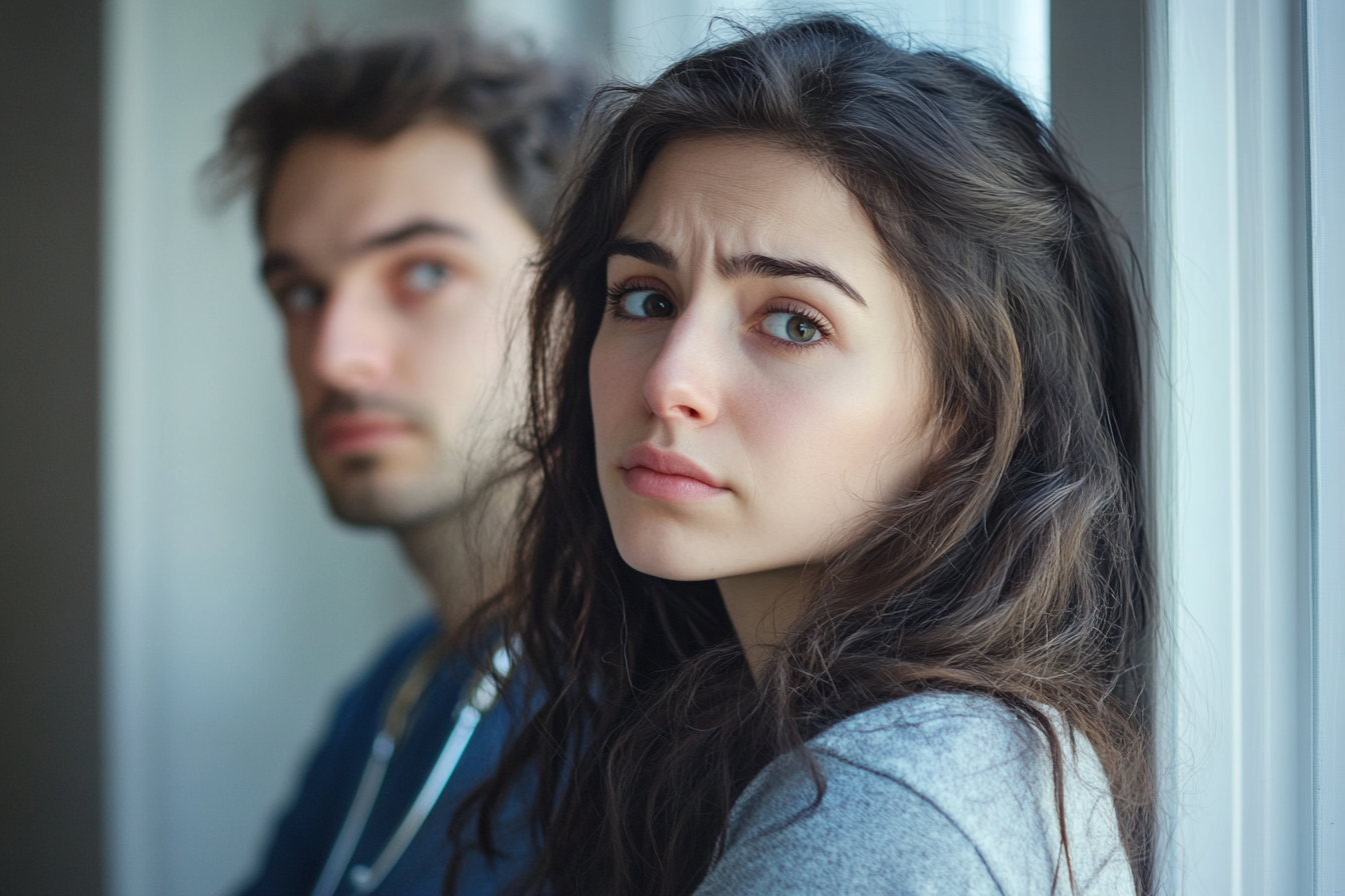 A sad couple in a doctor's office | Source: Midjourney