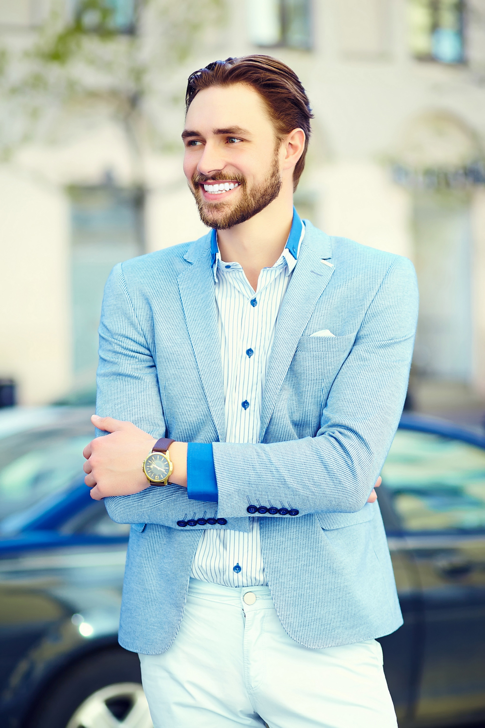 A stylish and handsome man smiling | Source: Freepik